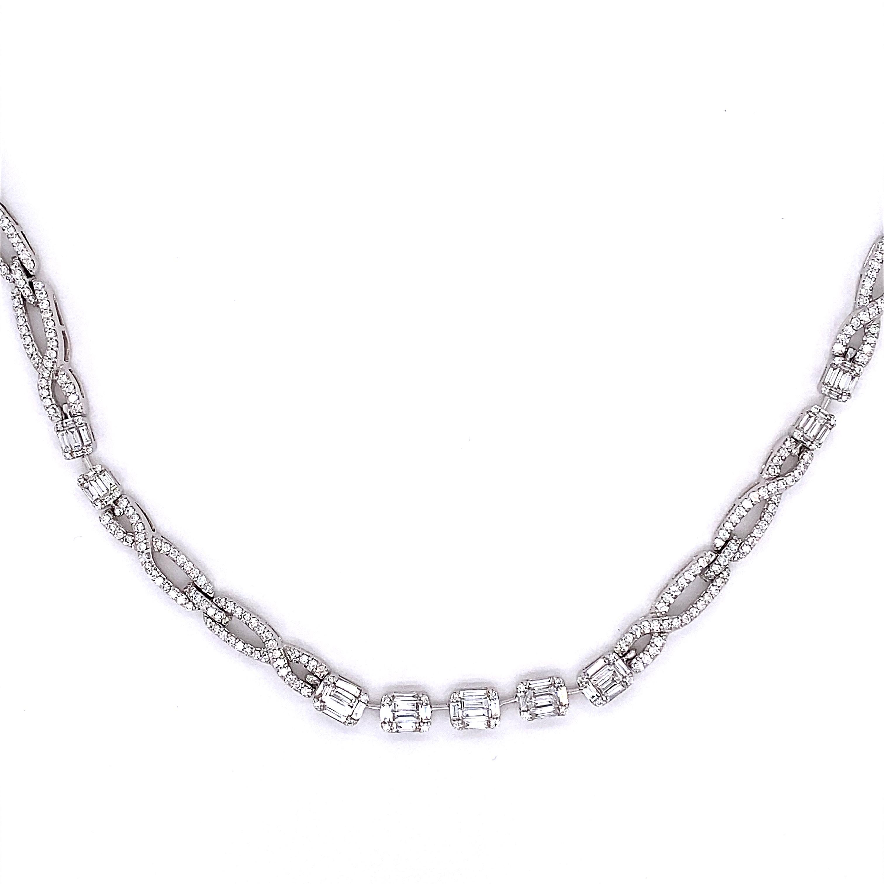 This stunning necklace features 13 emerald cut diamond clusters. The clusters are separated by a infinity designs made of round white diamonds. This necklace is 18