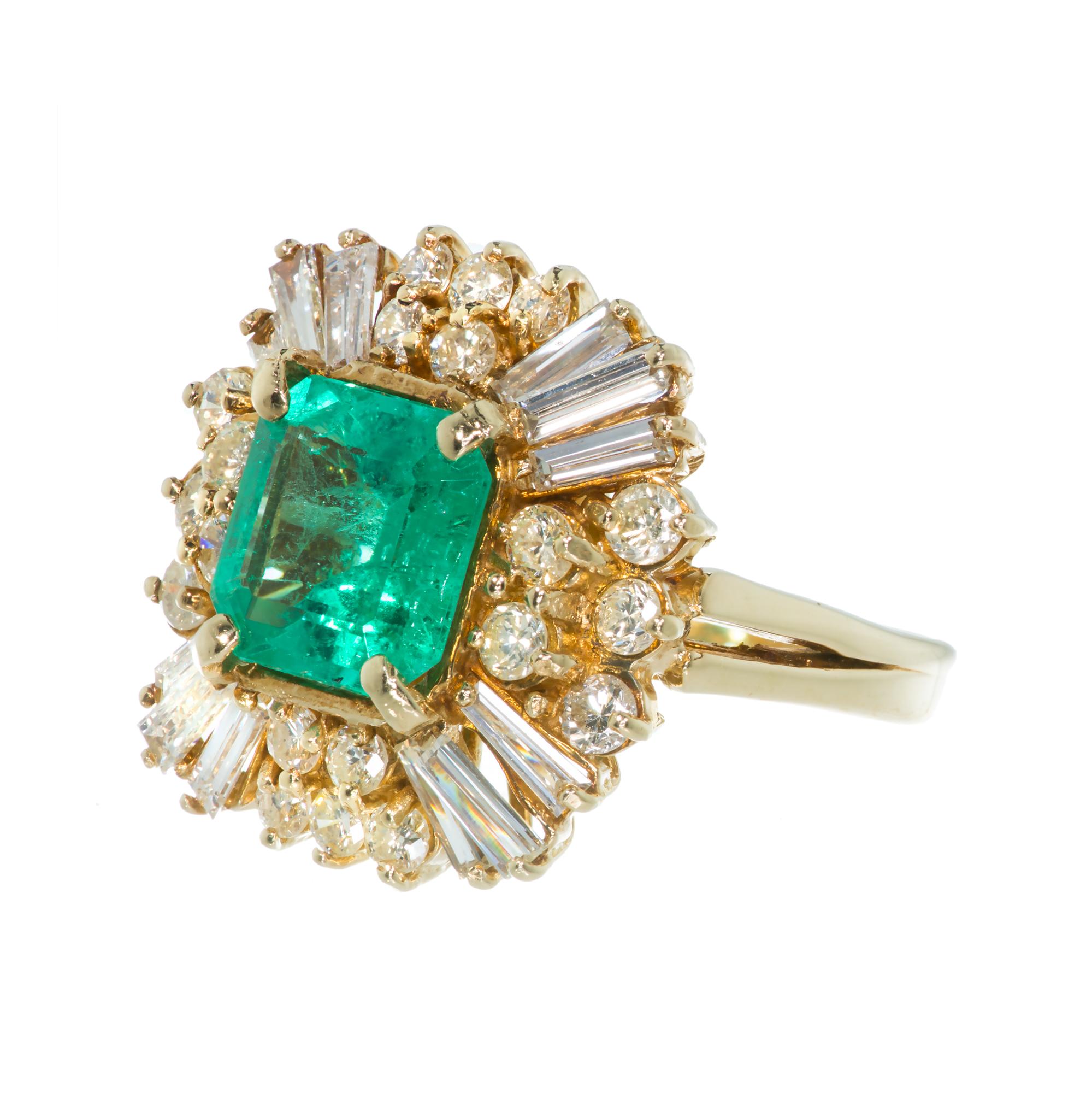 1960’s princess style emerald and diamond engagment ring. 4.00ct center emerald accented with tapered baguette and round diamonds in a handmade wire ring. Bright white sparkly white stones. The center is set with an Emerald with an unusually bright
