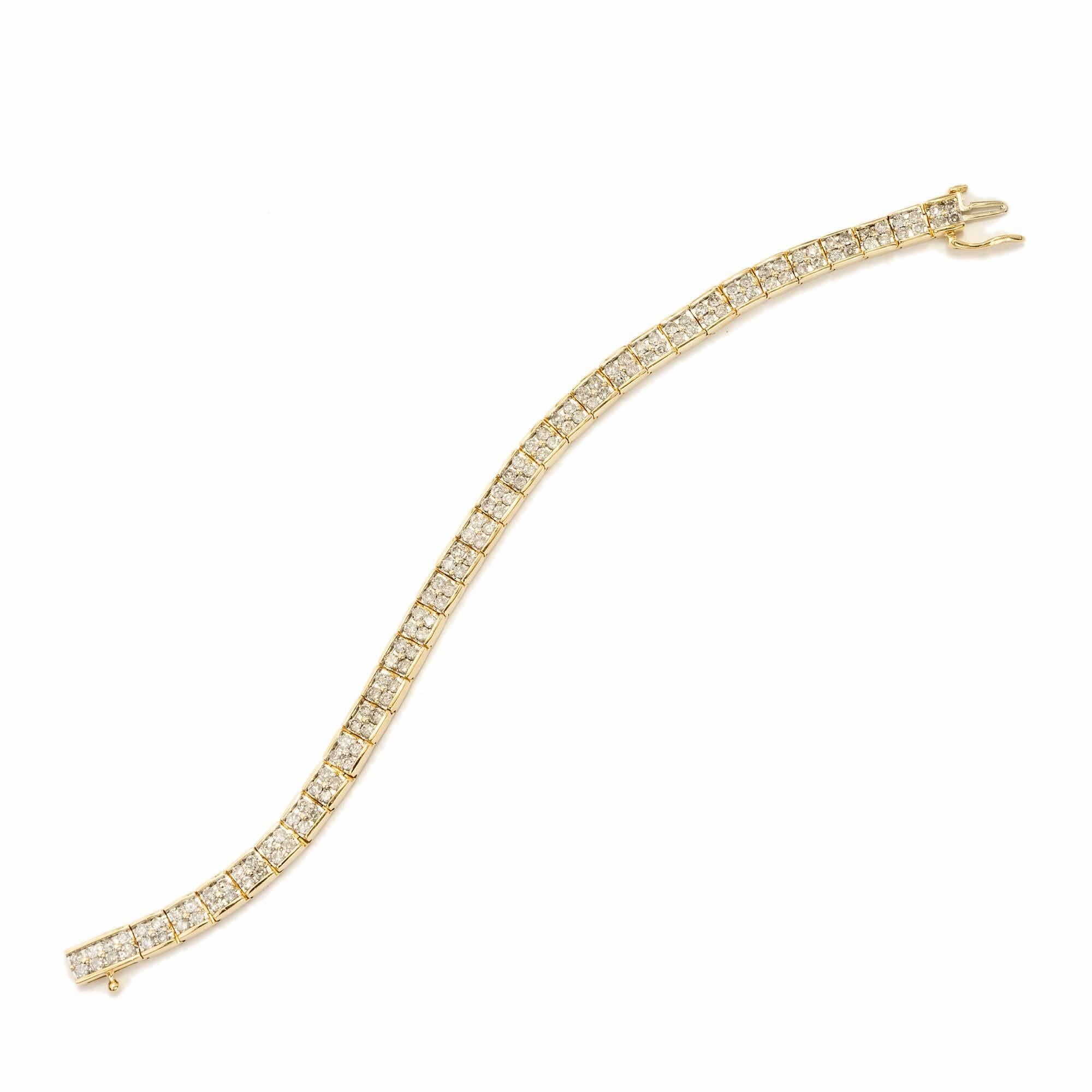 Solid and secure hinged link 14k yellow gold bracelet with hidden catch and side lock safety. 4.00cts of full cut diamonds. 

132 full cut diamond, approx. total weight 4.00cts, J to K, I1
Width: 6mm
Depth: 4mm
Stamped: 14k
 Length: 7 1/2