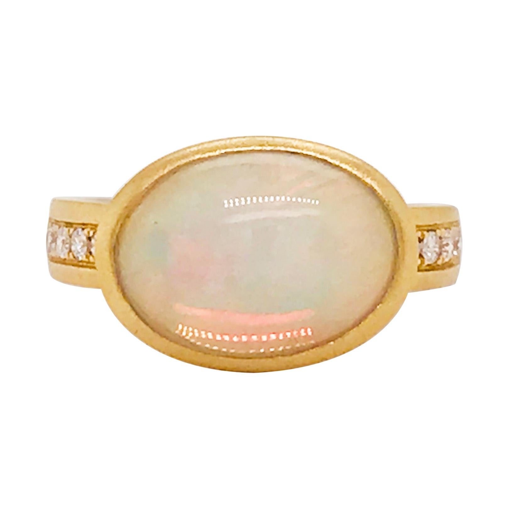 4.00 Carat Opal and 1/5 Carat Diamond Ring in Brushed 14 Karat Yellow Gold For Sale