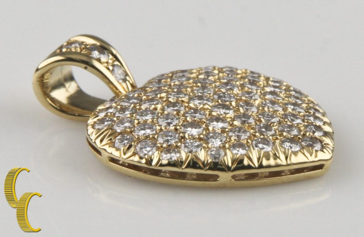 Gorgeous 18k Yellow Gold Pendant Encrusted with Pavé-Set Round Brilliant Diamonds
Total # of Diamonds = 75
Total Diamond Weight = Approximately 4 carats
Average Color = H - I
Average Clarity = SI2 - I1
Total Mass = 6.4 grams
23 mm Wide, 29 mm Long