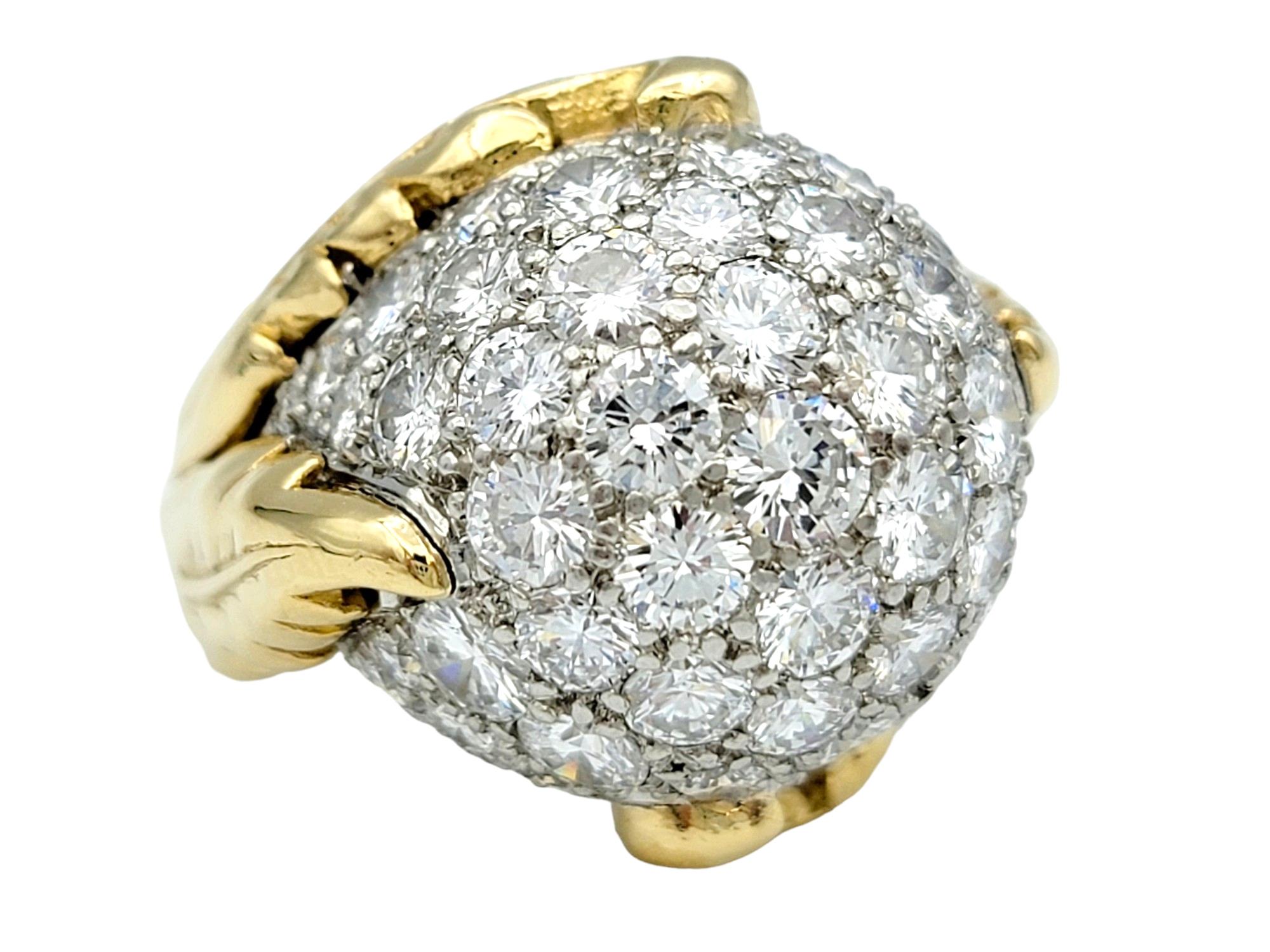 Ring Size: 6.5

This beautiful diamond-encrusted dome ring, set in lustrous 18 karat yellow gold, is a magnificent testament to luxury and opulence. At its center sits a resplendent spherical ornament, adorned with a breathtaking array of sparkling