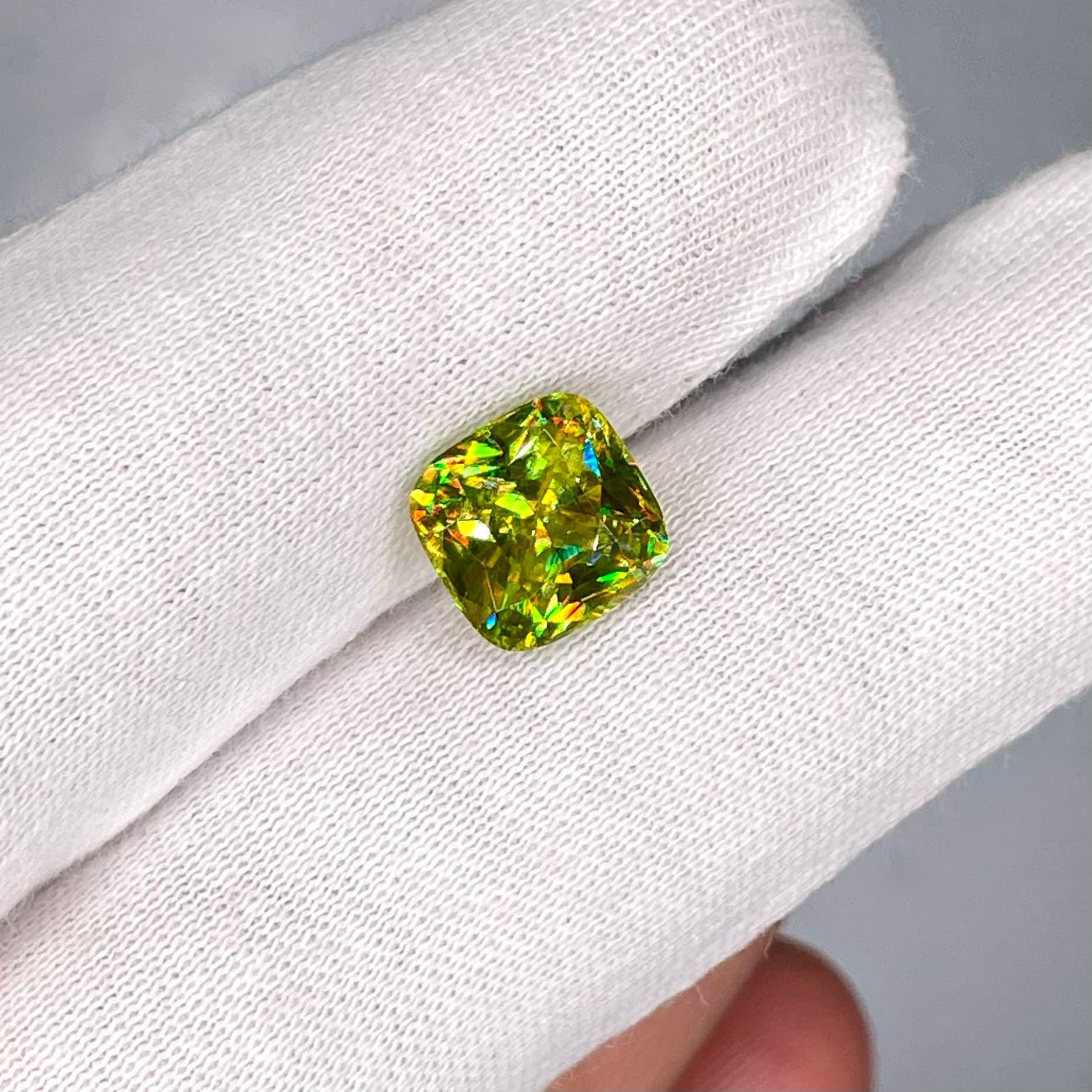 Weight 4.0 carats 
Dimensions 9.2x9.1x5.8 mm 
Treatment none 
Origin Madagascar 
Clarity VVS
Shape cushion 
Cut fancy cushion 



The exquisite beauty of a 4.00 carat Green Sphene stone unfolds in this fine example of a gem from Madagascar.