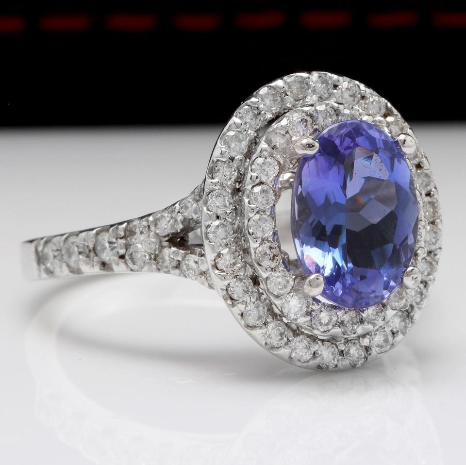 4.00 Carats Natural Very Nice Looking Tanzanite and Diamond 14K Solid White Gold Ring

Total Natural Oval Cut Tanzanite Weight is: Approx. 3.00 Carats

Tanzanite Measures: Approx. 9 x 6.5mm

Tanzanite Treatment: Heating

Natural Round Diamonds