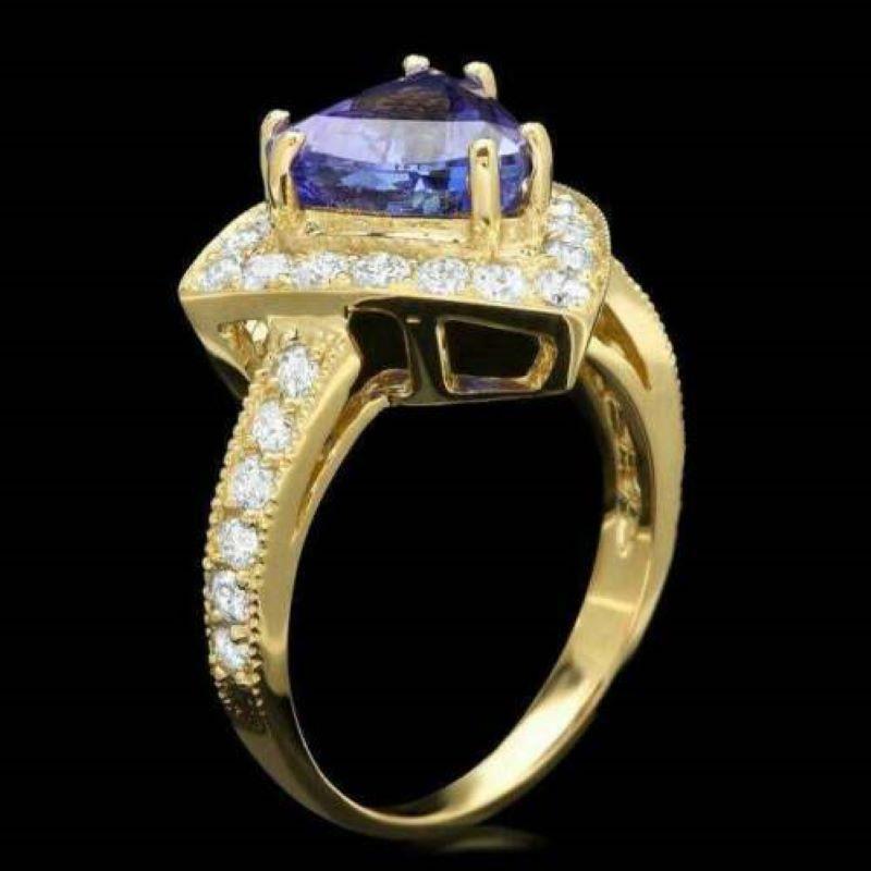 4.00 Carats Natural Very Nice Looking Tanzanite and Diamond 14K Solid Yellow Gold Ring

Total Natural Trillion Cut Tanzanite Weight is: Approx. 3.00 Carats

Tanzanite Treatment: Heat

Natural Round Diamonds Weight: Approx. 1.00 Carats (color G-H /