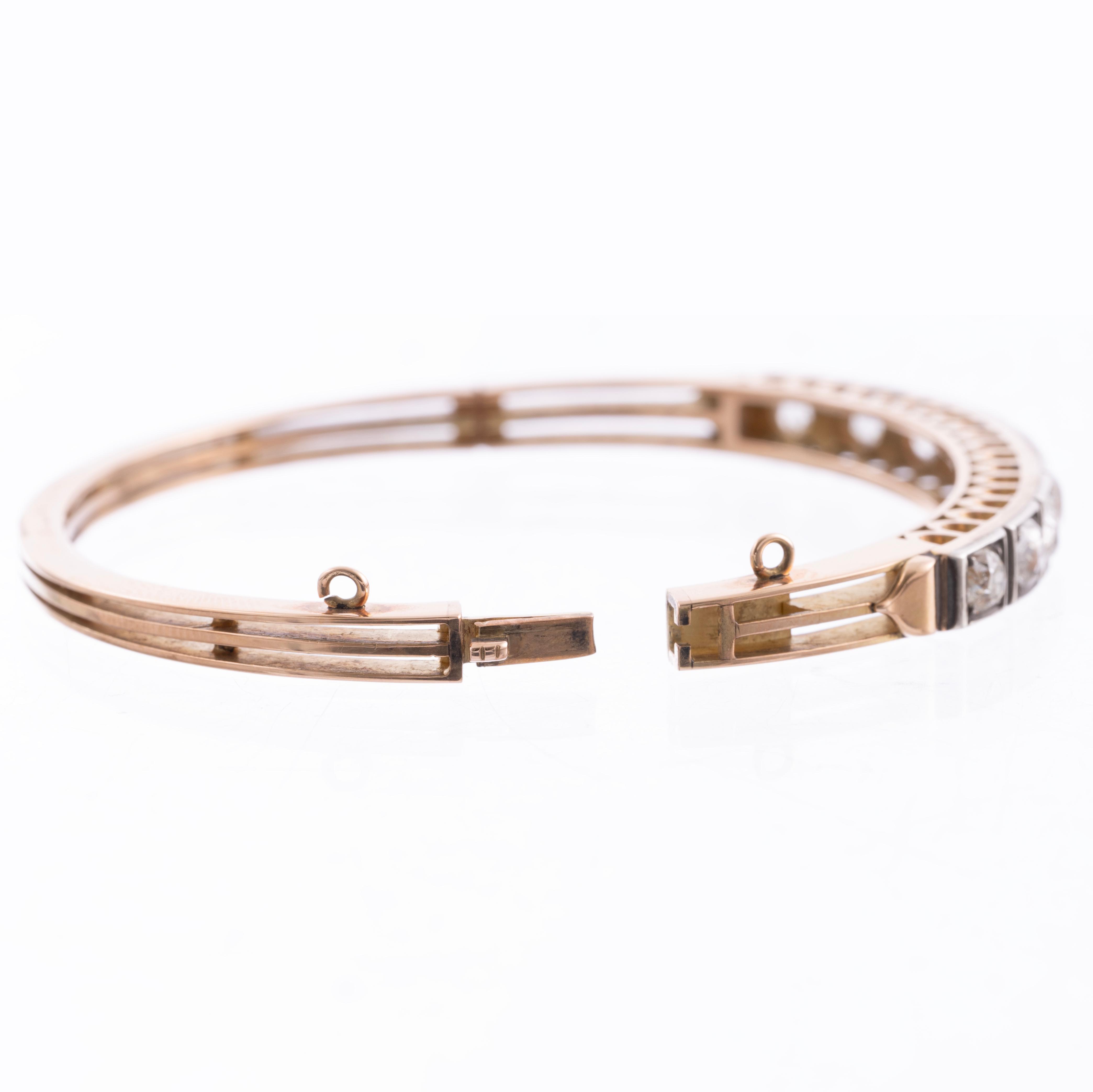 A exquisite example of an iconic Victorian bangle bracelet. This important antique bangle is adorned with well matched and fine Old Mine Cut Diamonds. The diamonds weigh approximately 4.00 carats in total, I-J color VS-SI2 clarity. The diamonds were