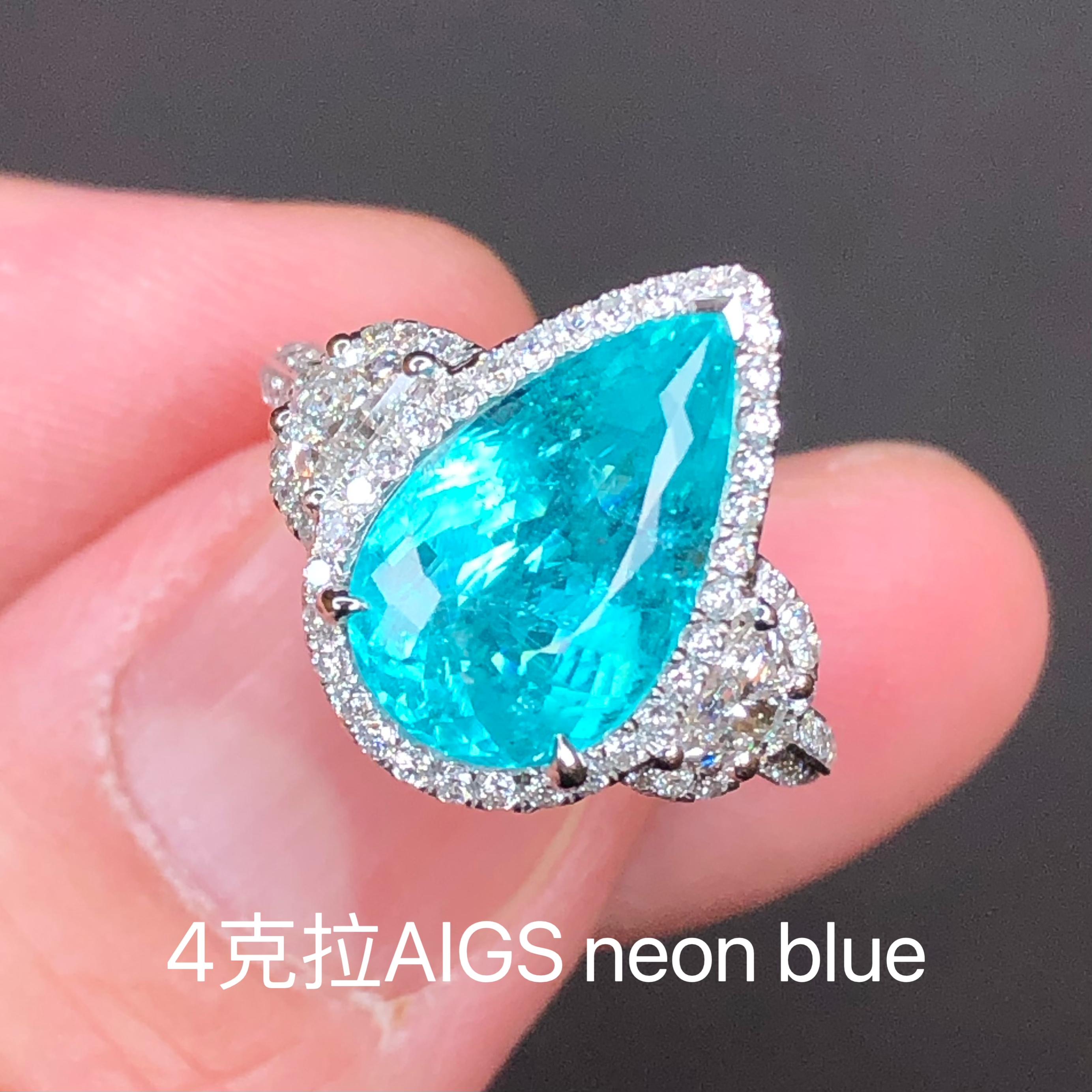 4.00 carats
Beautiful pear shape
AIGS Neon Blue. 
Very beautiful neon blue color. 
Clarify is not bad and definitely acceptable unless you need flawless ones. No black inclusions, no crack, no reflections. All inclusions are transparent. 
Origin: