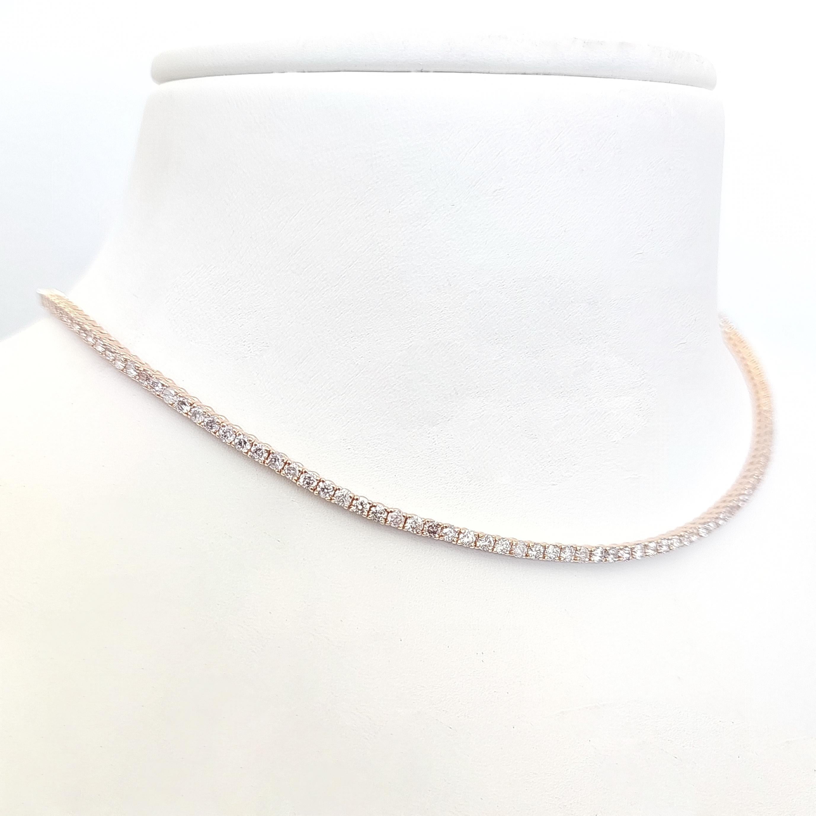 This breathtaking necklace features 162 fancy pink diamonds weighing 4.00 carats and elegantly set in 14kt pink gold. You can wear this elegant necklace when you are dressed up or even casually. 
The necklace is a perfect gift for your loved one.