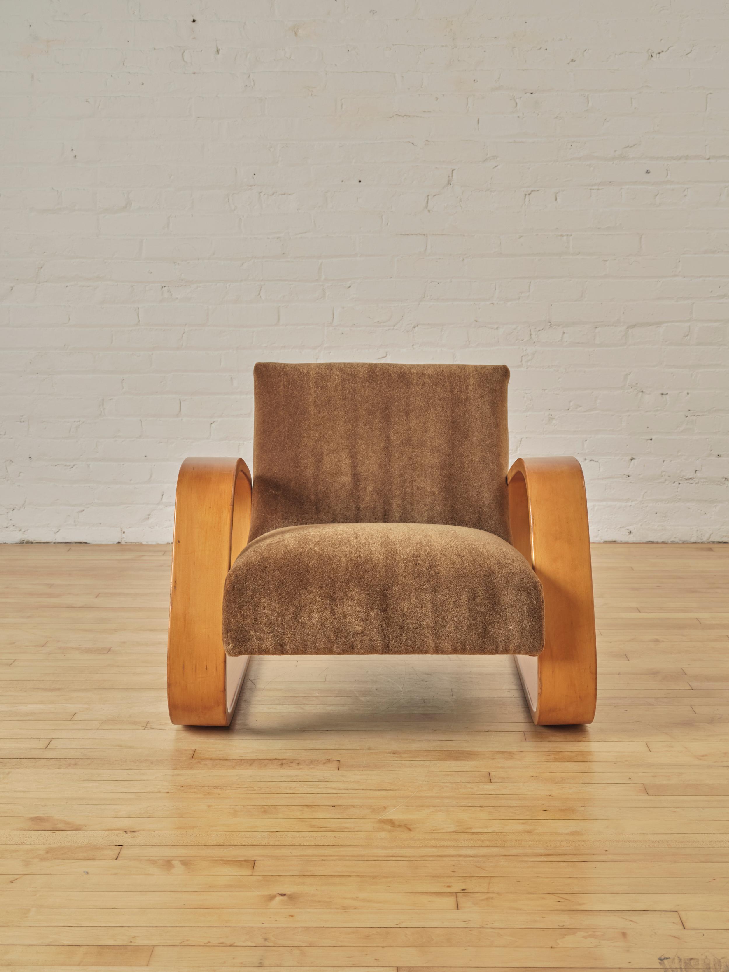 400 Tank Lounge Chair by Alvar Aalto for Artek, crafted in birch plywood with curved armrests. Newly reupholstered in chocolate mohair. Designed in 1936
