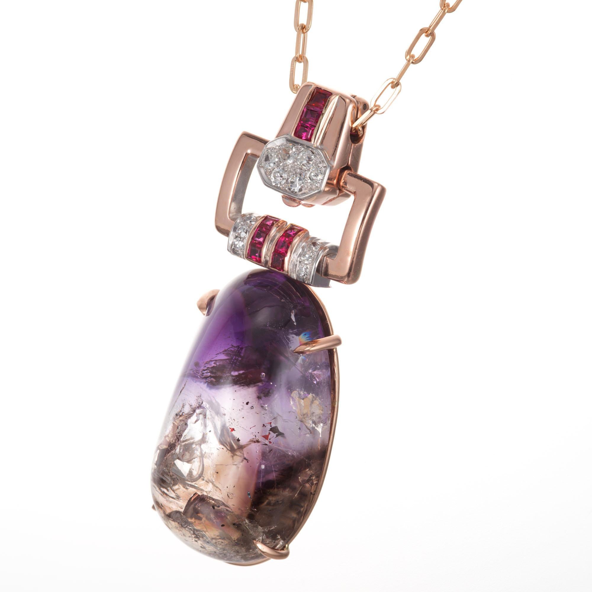 Art Deco Oval quartz, ruby and diamond pendant necklace. 40.00ct ova quartz, all natural and untreated with Amethyst shaded top and natural mineral inclusions including a liquid filled crystal inclusion with a gas bubble within the clear liquid that
