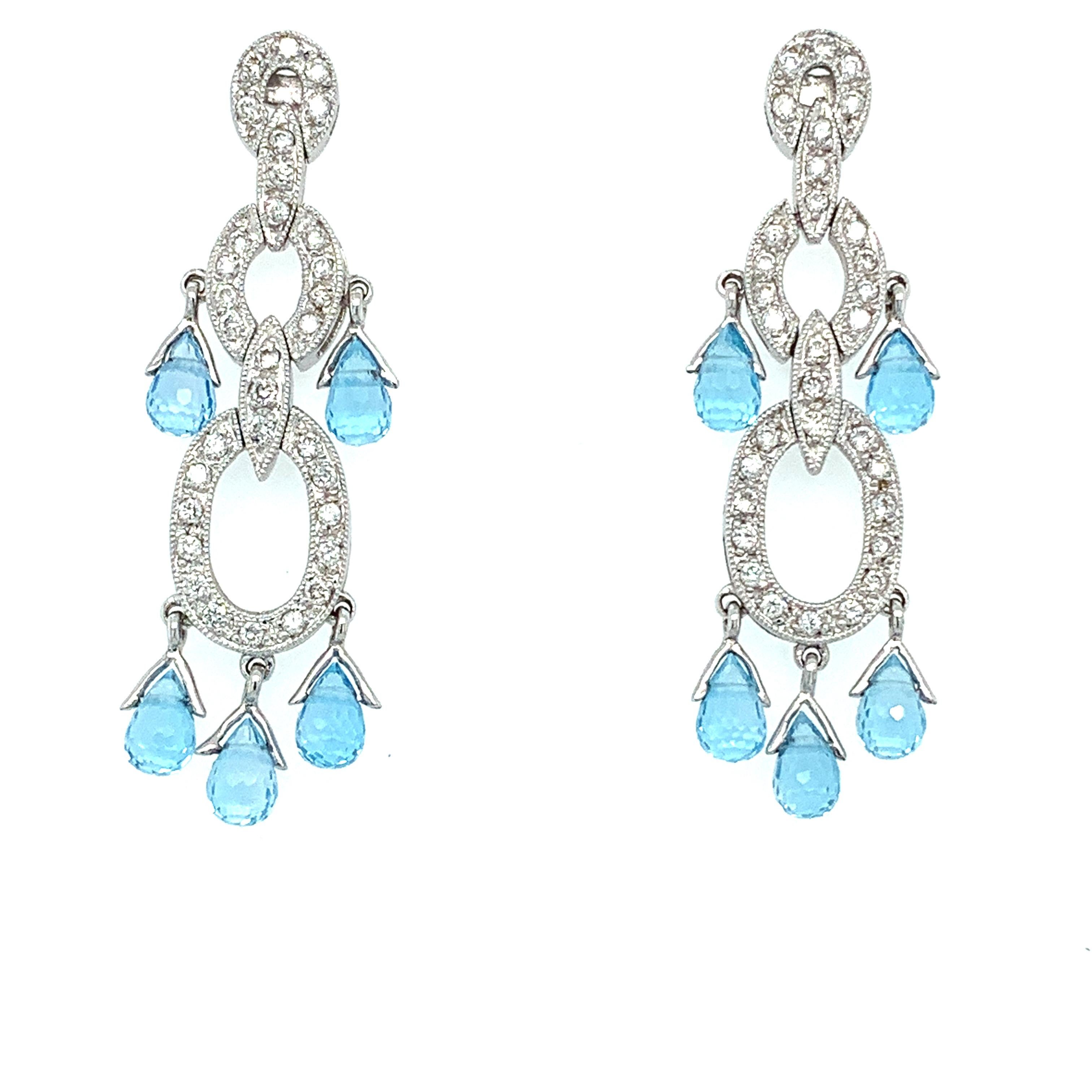 Beautiful aquamarine gemstone and diamonds drop dangle earrings in 18ct white gold. 
Composed of briolette old cut aquamarine gemstone light blue colour and accented by pave set fine quality diamonds.
Art deco cocktail style drop dangle earrings