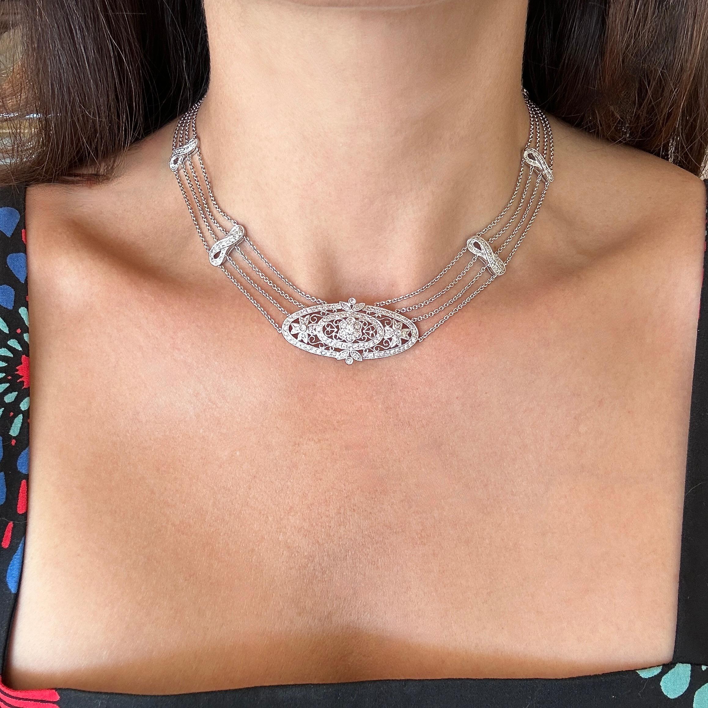 The Stunning Choker Style Necklace is Crafted in 18KT White Gold.
It is Adorned with 4.00CT of Brilliant Round Diamonds.
F-H Color  VS-SI Clarity. 
The Necklace Measures 14