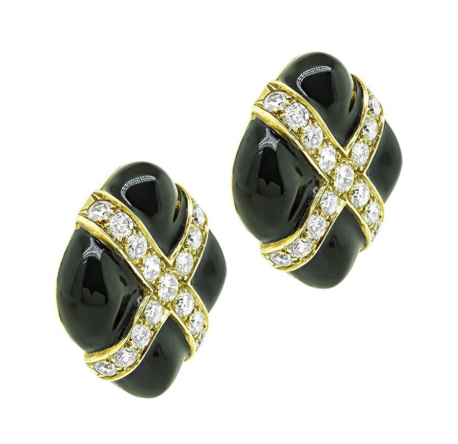 This is a charming pair of 18k yellow gold earrings. The earrings feature sparkling round cut diamonds that weigh approximately 4.00ct. The color of the diamonds is G-H with VS clarity. The diamonds are accentuated by lovely enamel inlay accent. The