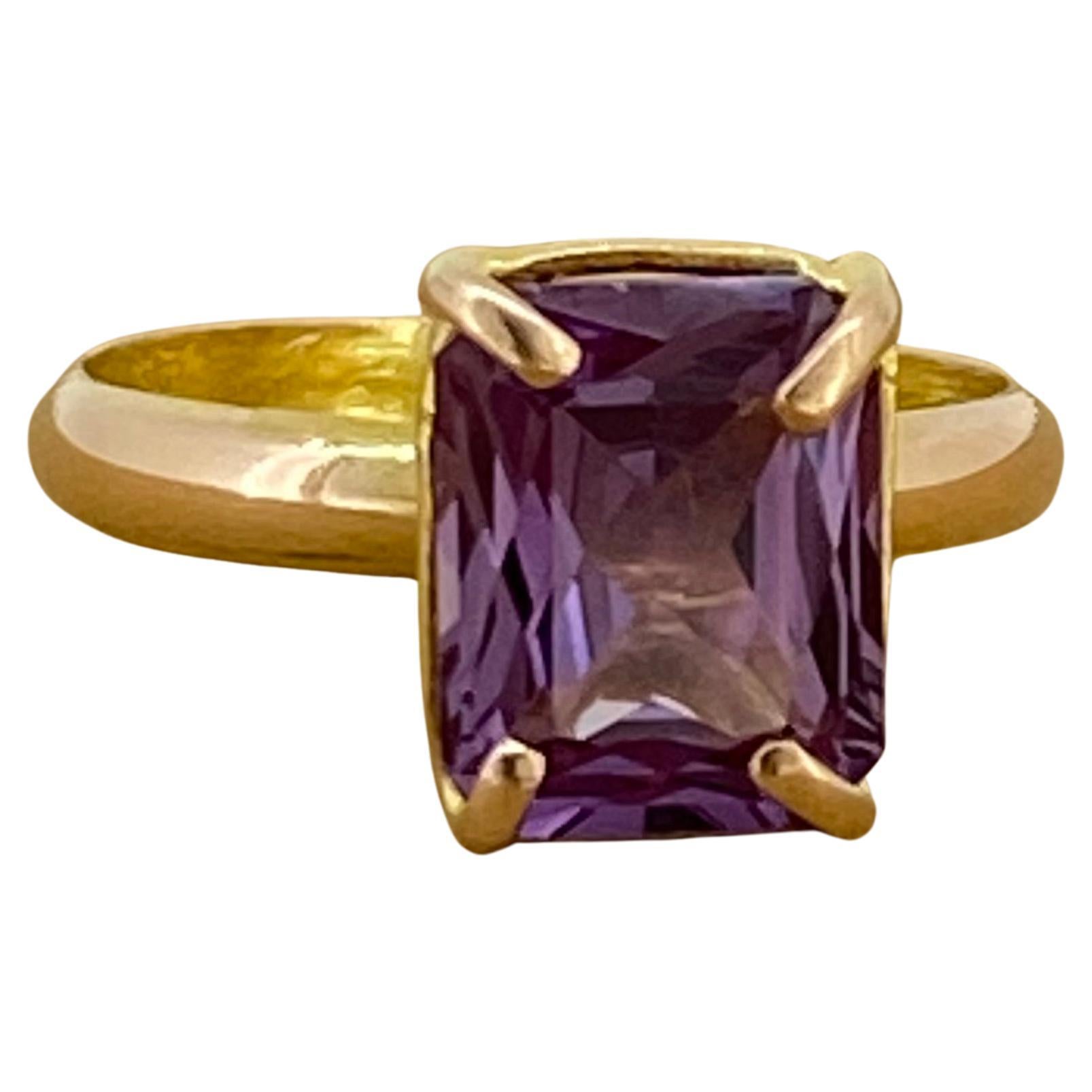 Of elegant & eternally popular solitaire design, 
this vintage ring looks fantastic on! 

Centering an emerald cut Natural Amethyst 
of vivid Royal Purple colour & excellent clarity, 
measuring 11mm x 8.5mm - 4.00ct approx. 

Securely 4-claw set in