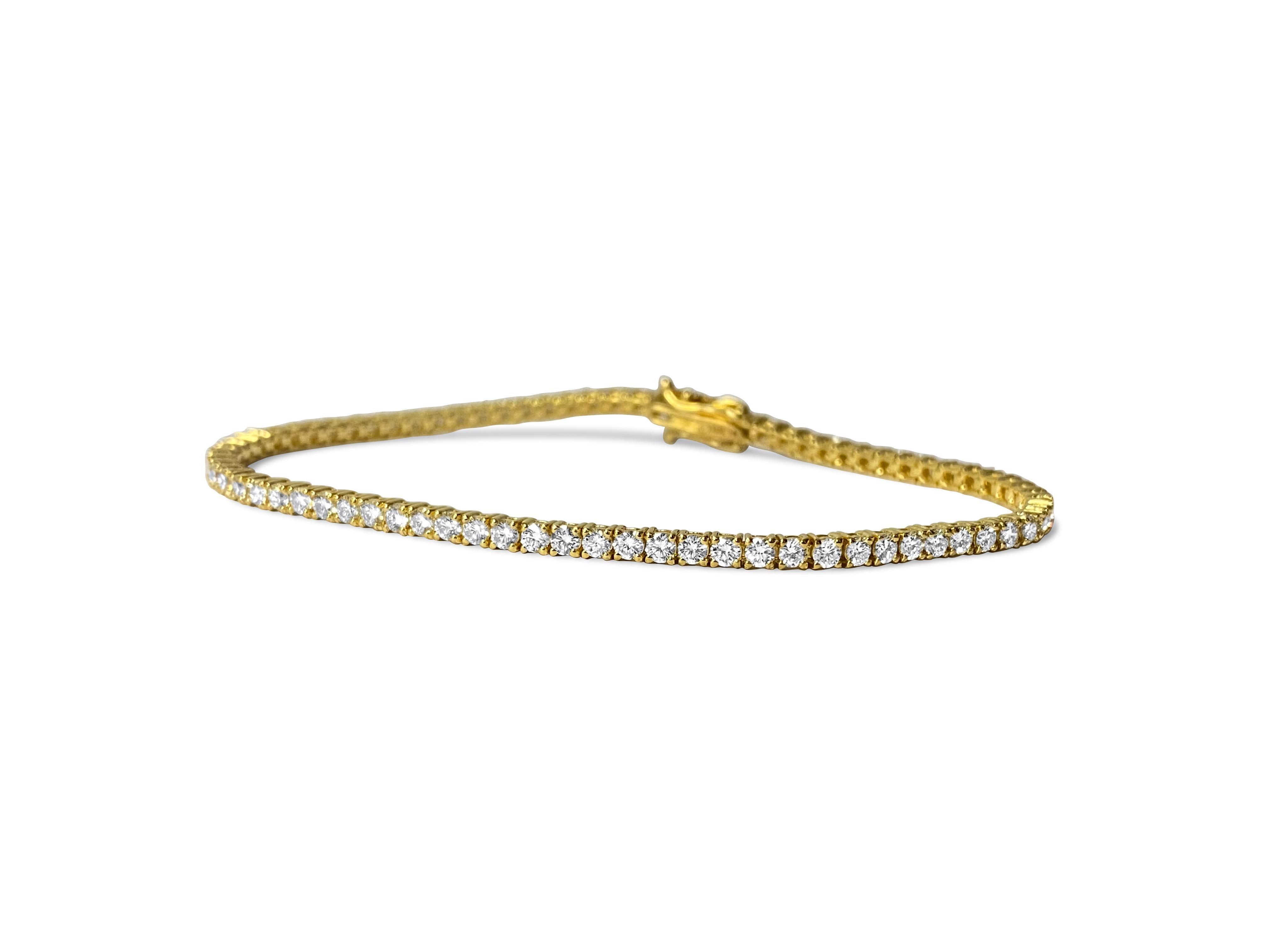 From luxurious 14k yellow gold, this exquisite unisex diamond tennis bracelet boasts a total of 4.00 carats of dazzling round brilliant cut diamonds. Each diamond showcases VVS-VS clarity and H color, ensuring exceptional brilliance and sparkle. Set