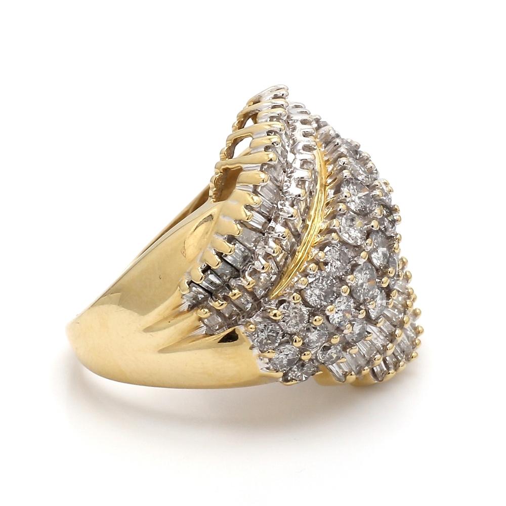 14K yellow gold, cluster ring.  Ring is set with sixty-four (64) tapered baguette cut diamonds and thirty-three (33) round brilliant cut diamonds weighing approximately 4.00ctw. Ring weighs 12.0 grams and is a size 8. 
All questions answered.
All