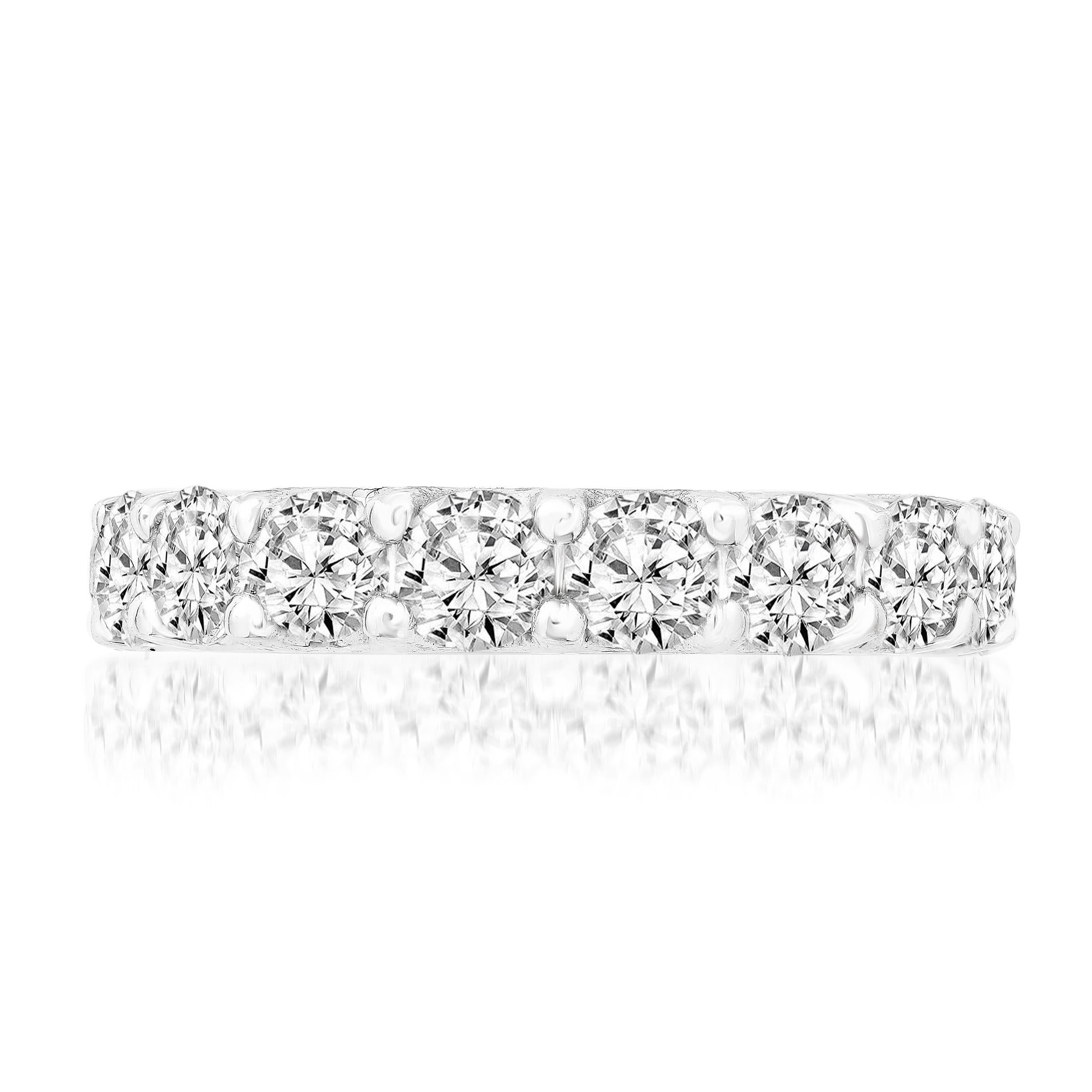 A luxurious and vibrant eternity wedding band showcasing 17 round brilliant diamonds set in a shared prong setting. Diamonds weigh 4.01 carats total. Made in polished 14k White Gold. 

Size 6.5 US (Sizable). One of a Kind  piece.
All diamonds are GH