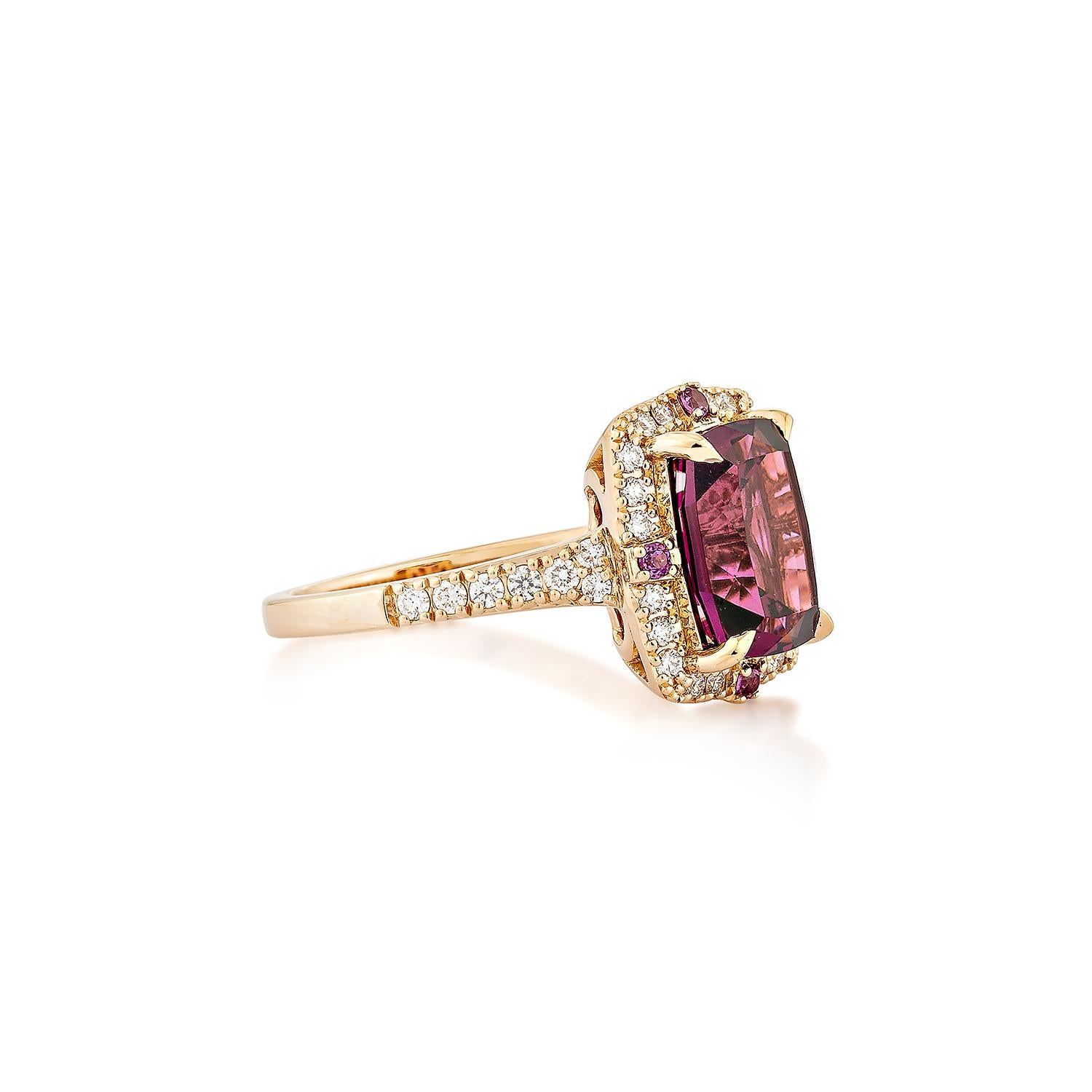 Sunita Nahata presents an elegant Rhodolite fancy ring in a cushion shape, set with sparkling white diamonds. This exquisite piece exudes grace and elegance, making it perfect for both daily wear and special occasions. Crafted from 18-karat rose