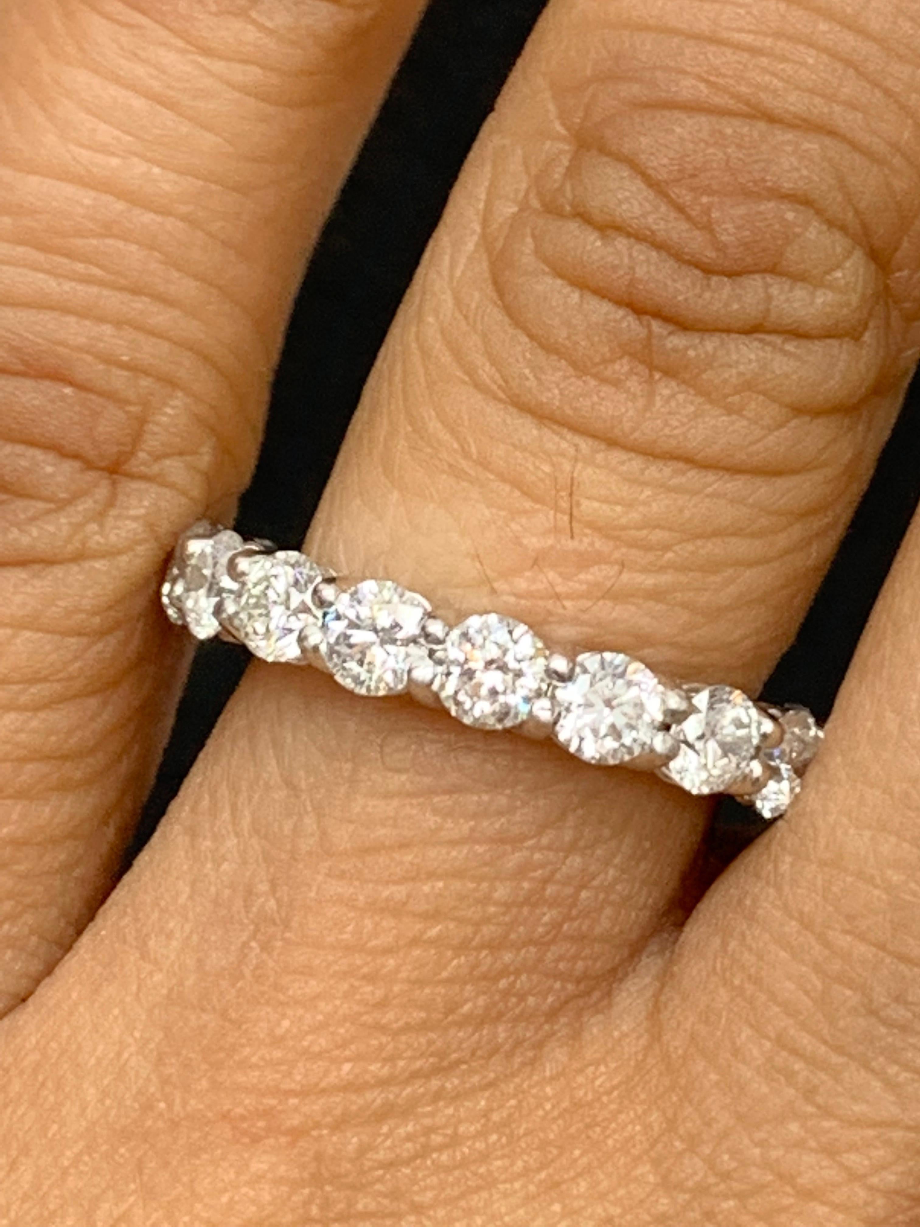 A classic and timeless eternity band style showcasing a row of round brilliant diamonds set in a shared-prong 14k white gold mounting. 18 Diamonds weigh 4.01 carats.
Size 6.5 US (Sizable). One of a Kind piece.

All diamonds are GH color SI1