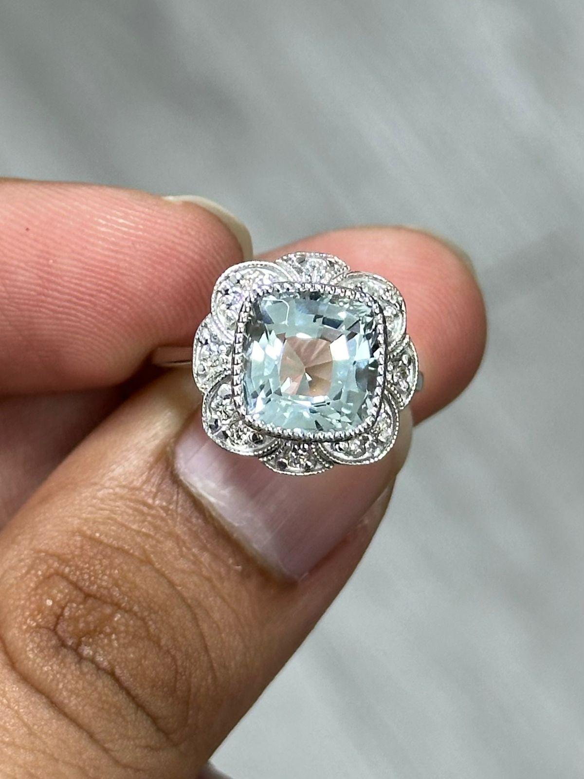 An extraordinary and remarkable Aquamarine Ring that we're sure you won't come across this easily. This beauty has a 4.01 Carat, square cushion shaped Aquamarine!! 

This Aquamarine ring is a dream for all the aquamarine lovers as it has an elegant,