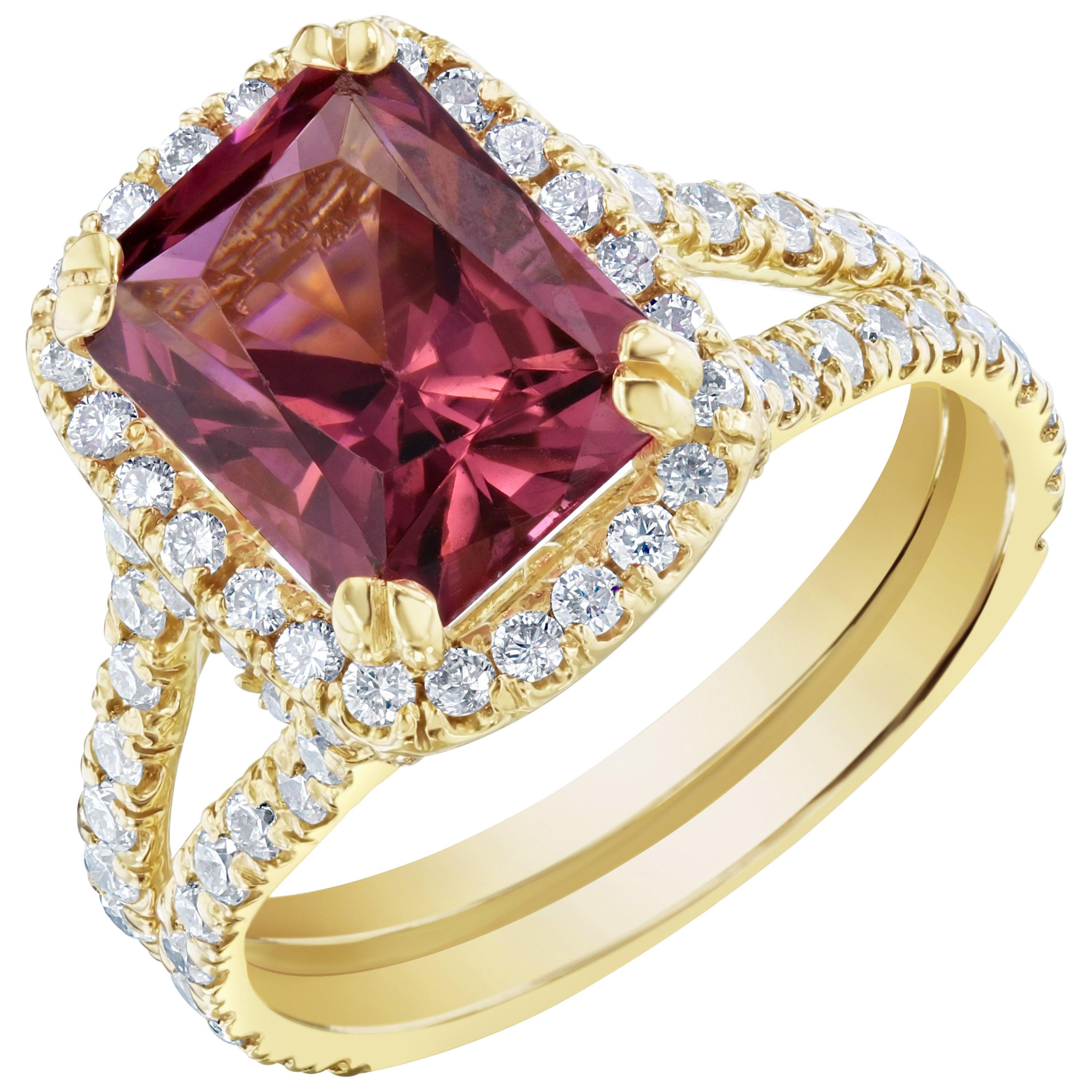 Stunning Dark Pink Tourmaline and Diamonds set in a spit-shank and halo setting! This ring has a 2.97 carat Rectangle Cut Tourmaline in the center of the ring and is surrounded by 92 Round Cut Diamonds that weigh 1.04 carats. The clarity and color