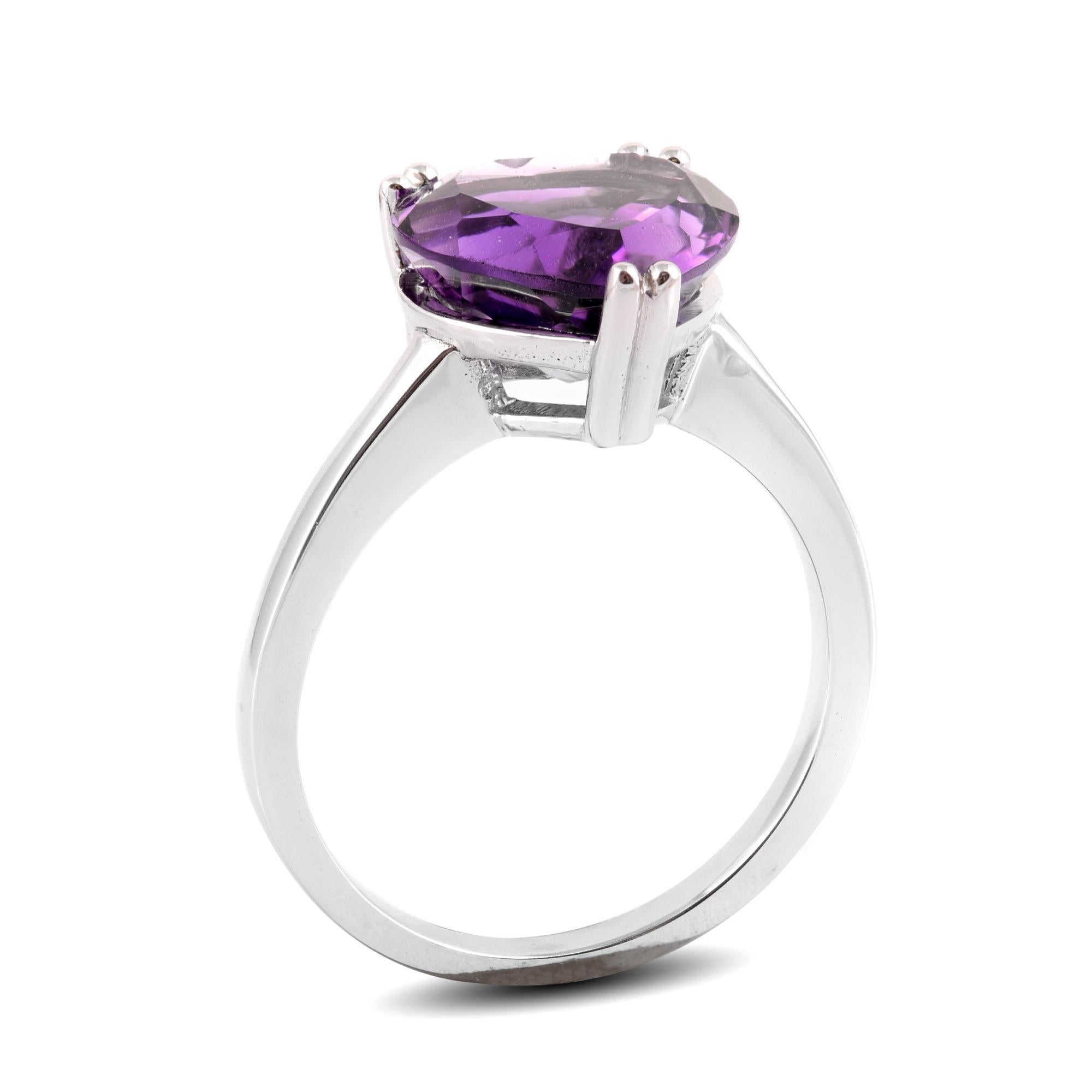 A color that has a glorious avatar, here is a 4.01 carat Amethyst that set in 14K White Gold. Allowing light to create the spectacle intended, this beautiful gemstone has unmatched brilliance. With royal hues, the violet colored center stone will