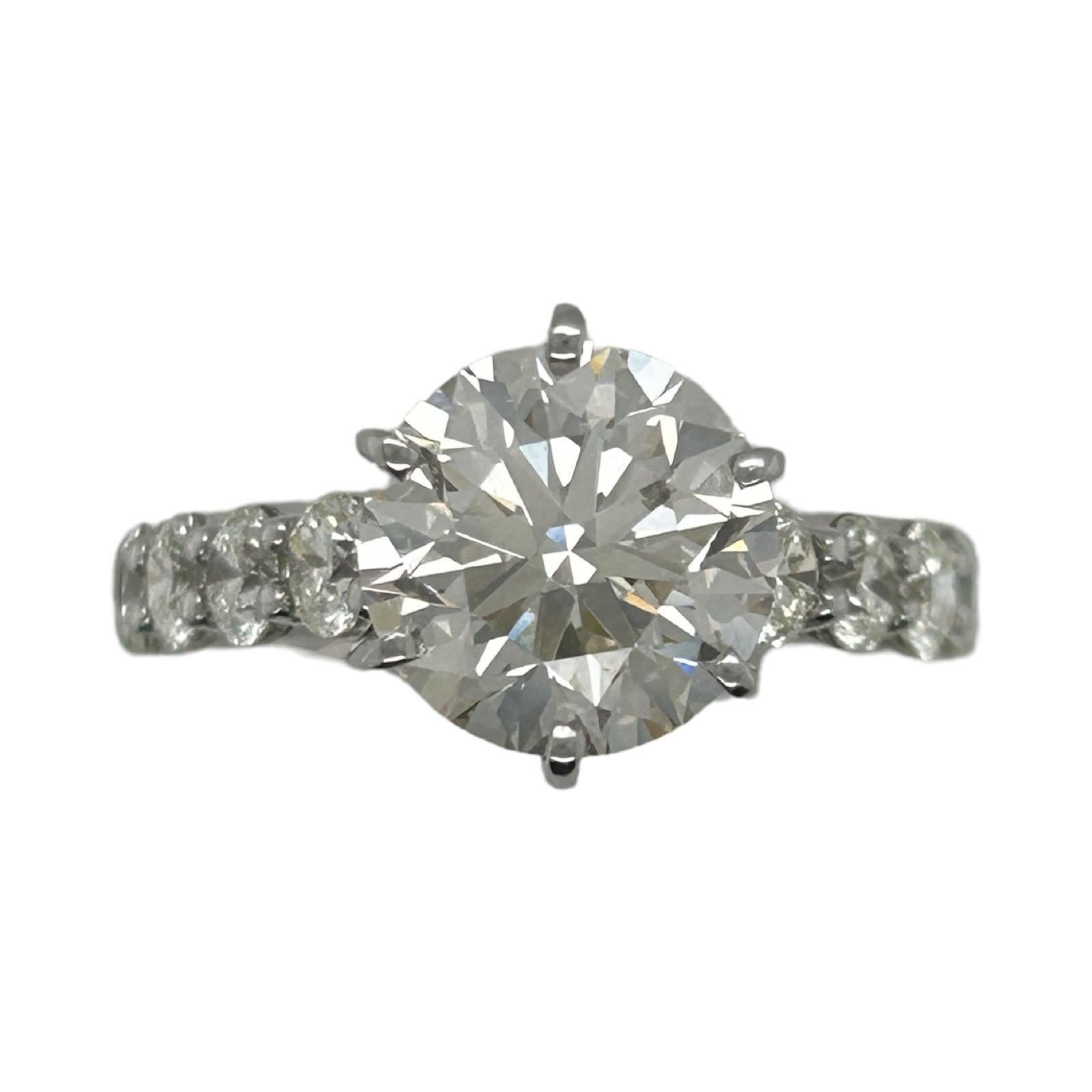 Diamond Details:
TCW: 4.01
Color: L
Clarity: VS2
Cut: Excellent
Polish: Excellent
Symmetry: Excellent
14kt White gold ring with diamonds on each side
RING SIZE 8 (can be sized)

GIA Report # 3455943801