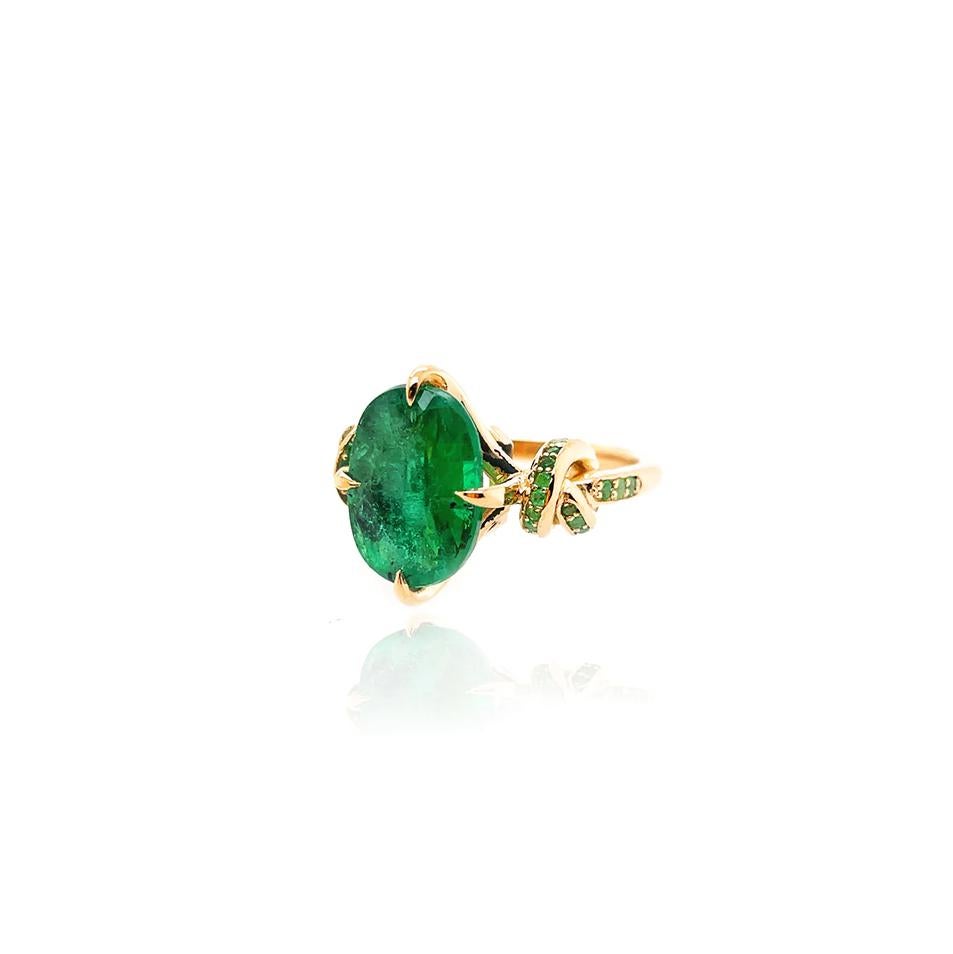 Glamorously bold and unabashedly seductive. This showstopper ring features an intense green oval cut Emerald embraced North, South, East, West by gold talons and embraced by diamond encrusted ropes. 4.01ct Natural Emerald.

Oval cut
4.01ct natural
