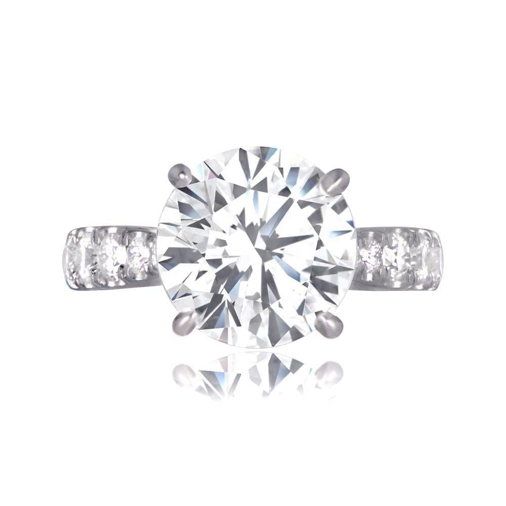 A stunning 4-carat diamond engagement ring, accented by seven diamonds on each shoulder, all prong-set in a platinum mounting. The centerpiece is a 4.01-carat round brilliant diamond with K color and VS2 clarity.

Ring Size: 6.5 US, Resizable
Color: