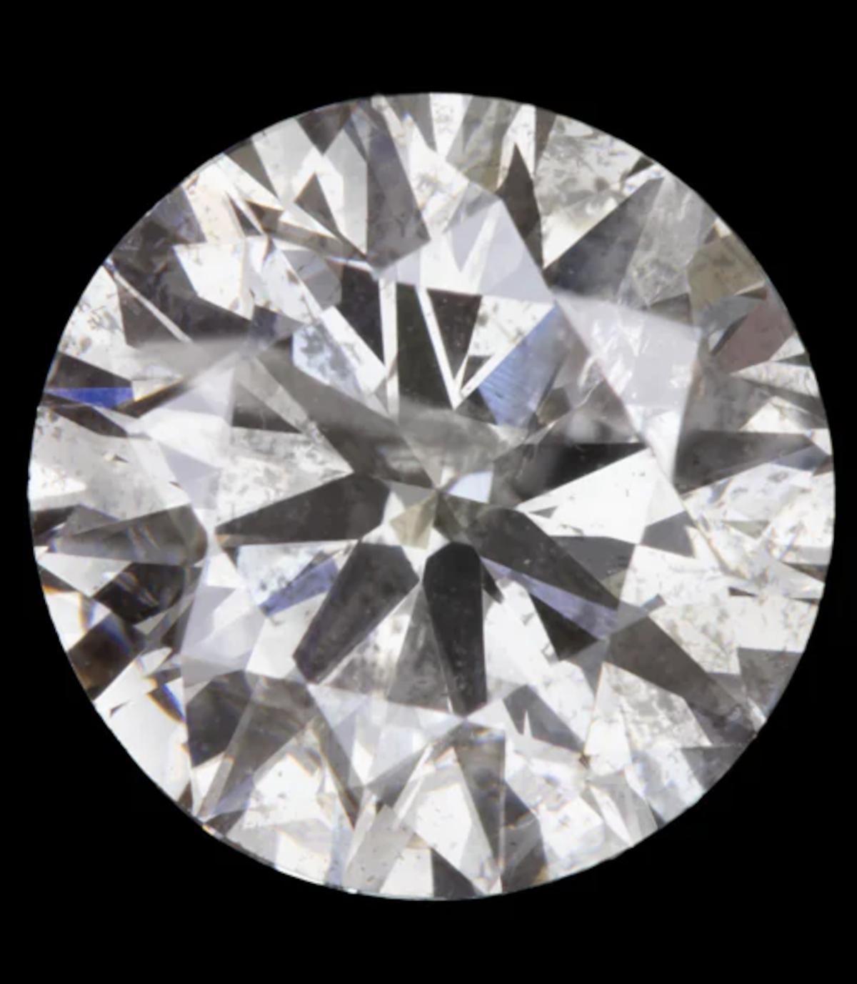 Behold this remarkable pair of round brilliant cut natural diamonds, totaling an impressive 4.02 carats. Their expertly executed cuts result in a vibrant sparkle that captivates the beholder. Offered at a substantial value for their size, these