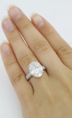 Anillo de diamantes brillantes ovalados con certificado GIA de 4,02 quilates en platino
