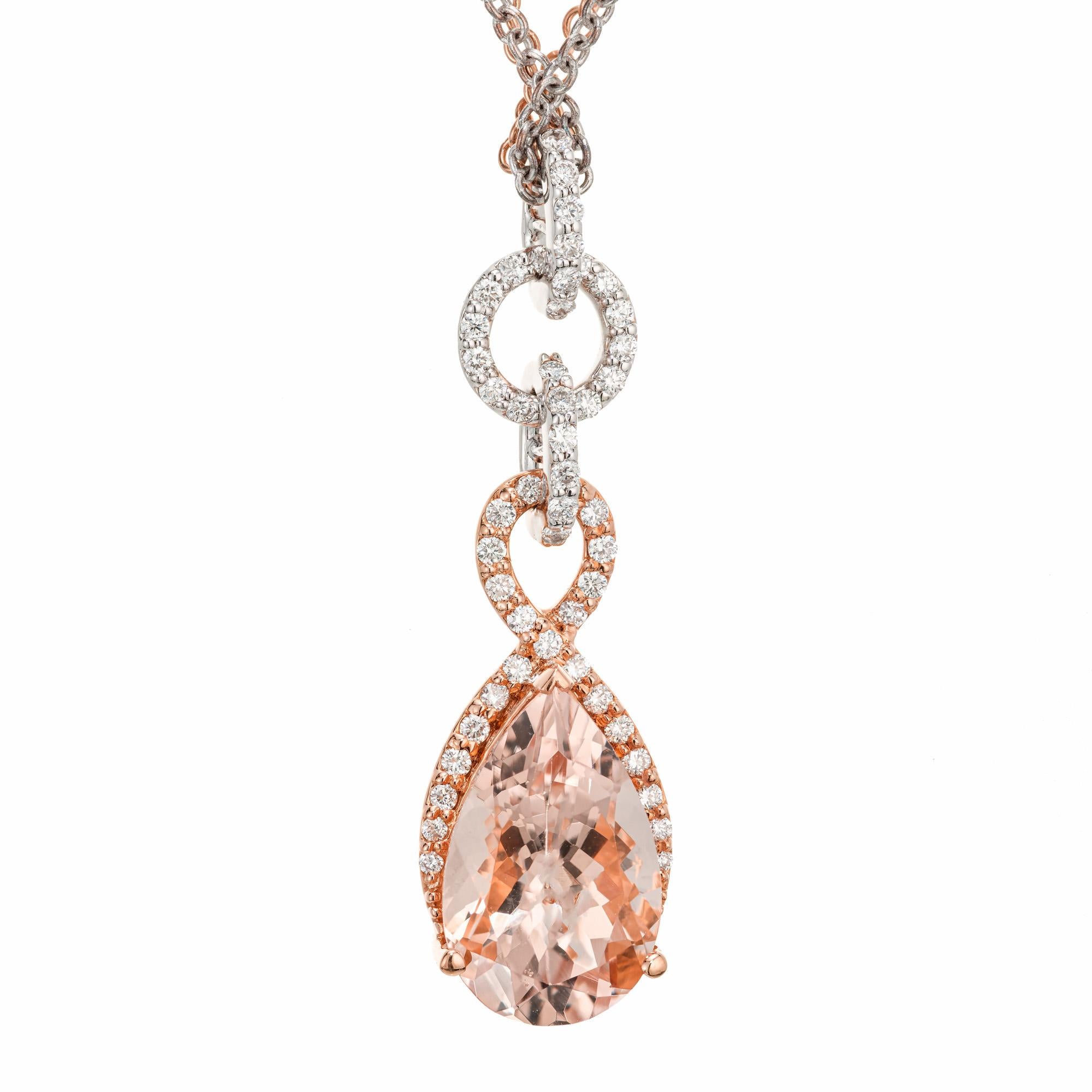Rose and white gold diamond pendant. 1 Pear shaped morganite with a halo of round brilliant cut diamonds. The chains are 18k white and rose gold. 18 inches. 

1 par shaped morganite, approx. total weight: 4.02cts
51 round brilliant cut diamonds,