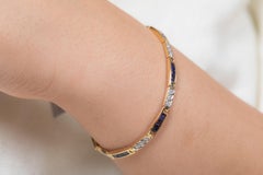 Tennisarmband aus 14 Karat Gelbgold mit 4,02 Karat natürlichem blauem Saphir und Diamant