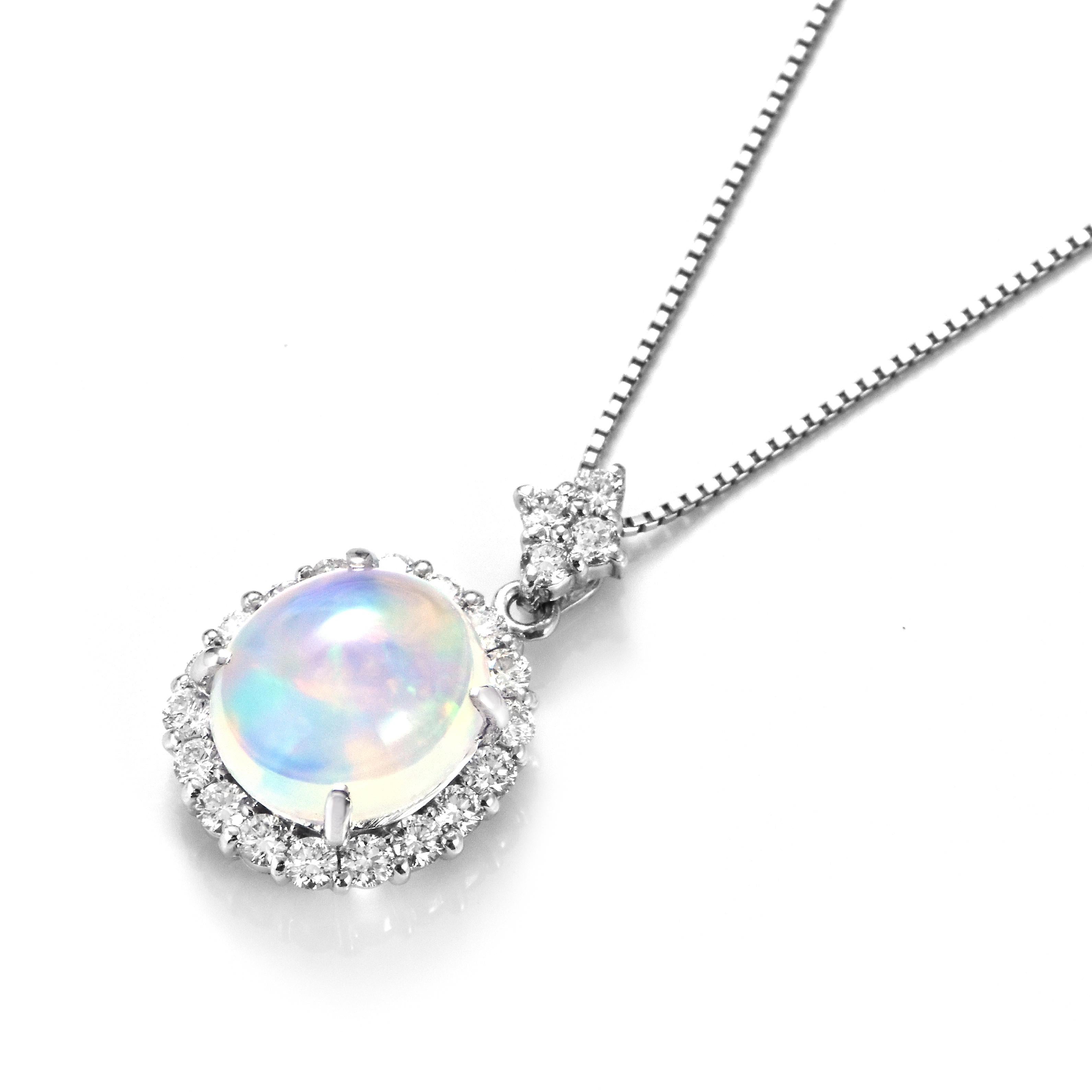 A beautiful pendant featuring a 4.02 Carat Natural Water Opal and 0.86 Carats of Diamond Accents set in Platinum. Opals are known for exhibiting flashes of rainbow colors known as 