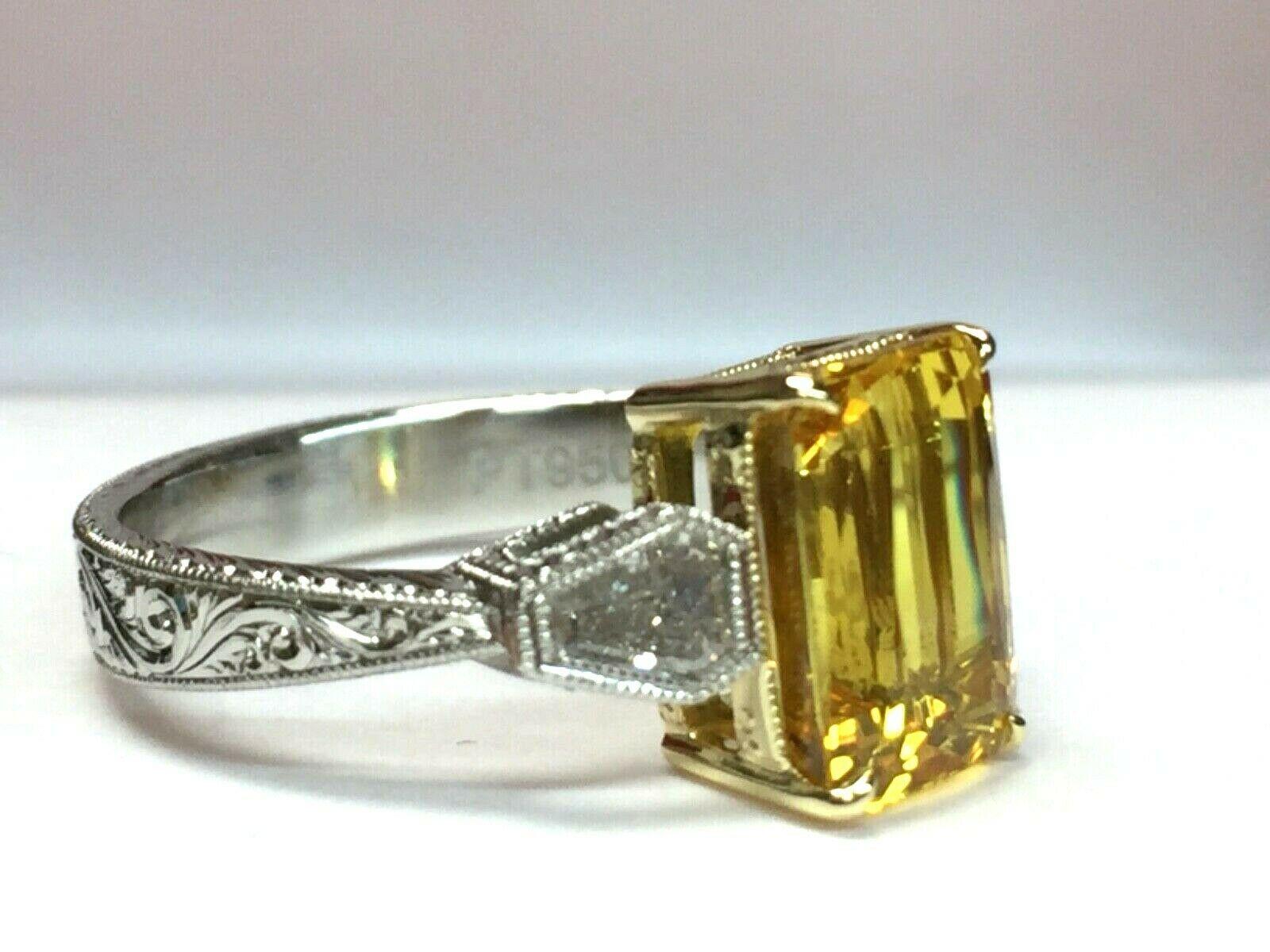 For your consideration is a 4.02 carat Octagonal Step cut, natural, bright deep yellow sapphire set in a brand new platinum with 18k yellow gold basket setting with approximately .65 carats of natural G color VS clarity white diamonds.  The sapphire