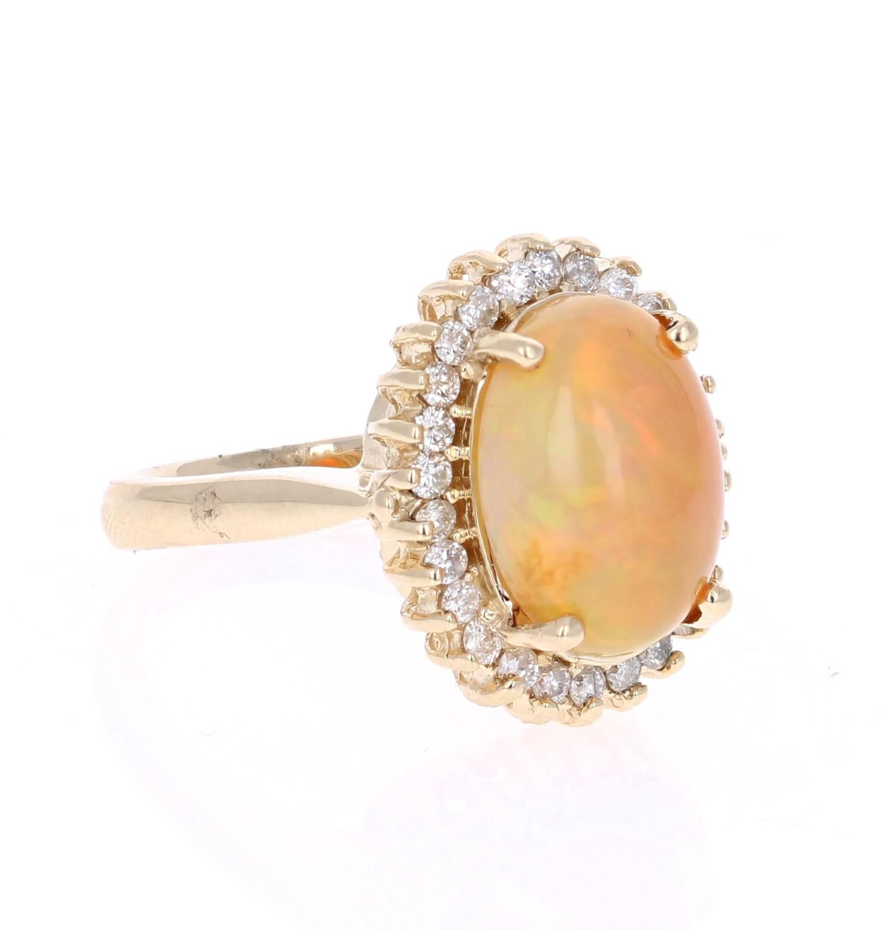 4.02 Carat Oval Cut Opal Diamond Yellow Gold Cocktail Ring!

Stunning 4.02 carat Opal and Diamond Ring in 14K Yellow Gold.  The Opal in this Ring weighs 3.45 carats and is surrounded by 26 Round Cut Diamonds that weigh 0.57 carat.  The total carat