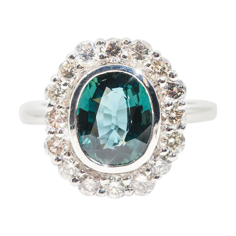 4.02 Carat Oval Unheated Colour Shift Sapphire and 1.18 Carat Diamond Halo Ring