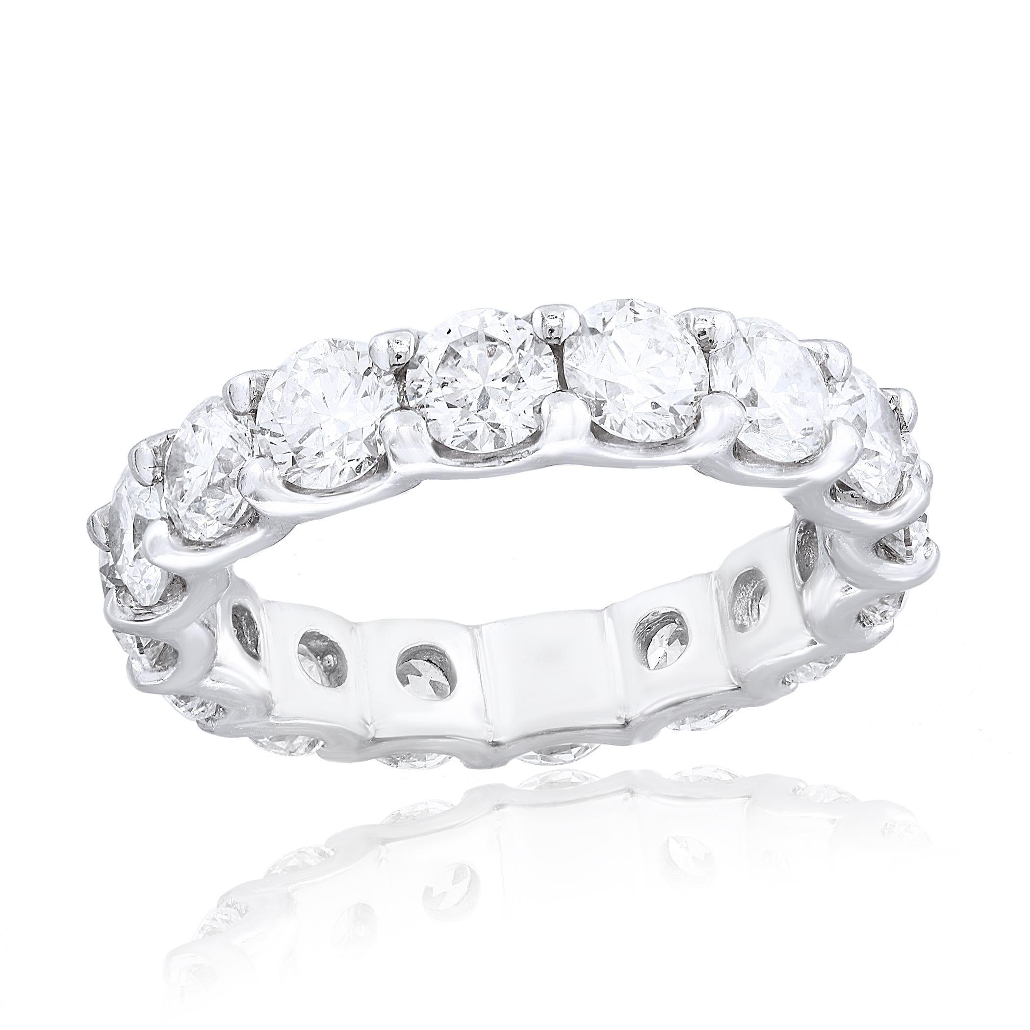 A classic and timeless eternity band style showcasing a row of round brilliant diamonds set in a shared-prong 14k white gold mounting. Diamonds weigh 4.02 carats.
Size 6.5 US (Sizable). One of a Kind  piece.
All diamonds are GH color SI1