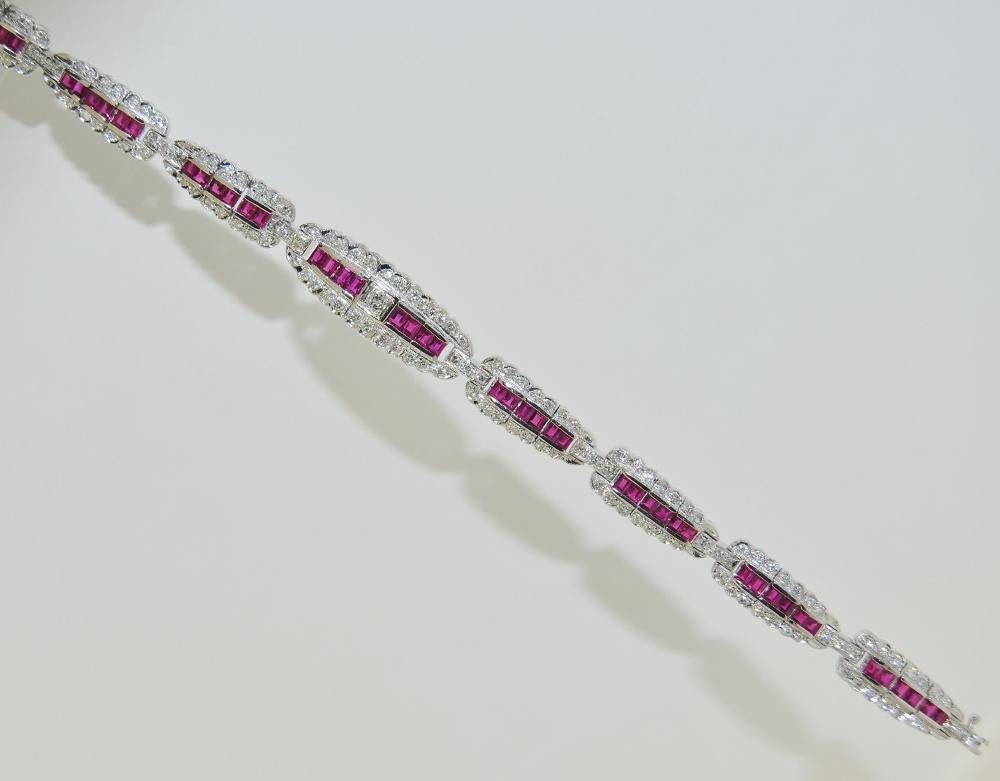 Ladies Bracelet featuring 4.02 Carat Princess Cut Rubies and 1.38 Carat White Diamonds.  This new bracelet is made of 18 Karat White Gold, length size 7 inches.