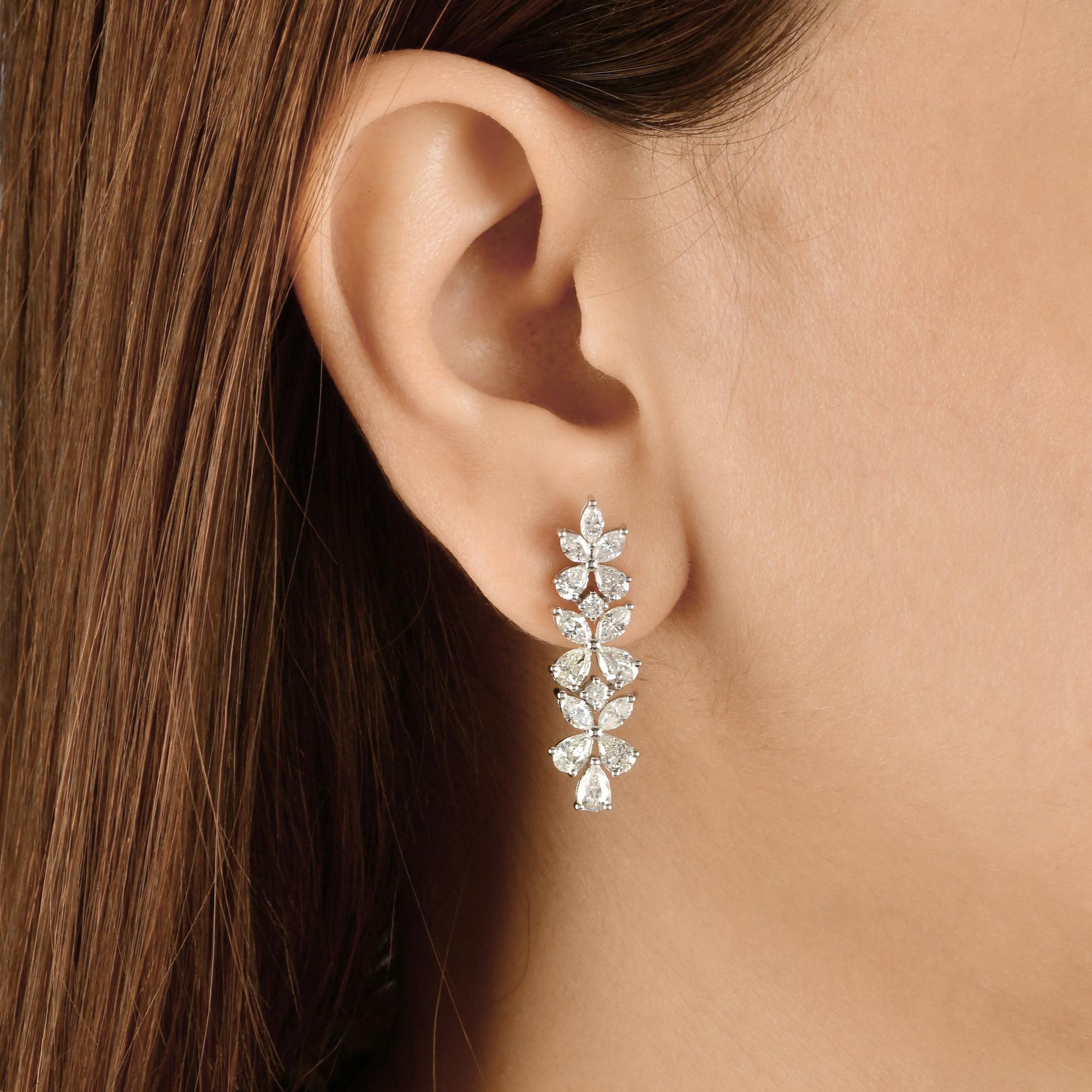 4.02 Carat SI Clarity HI Color Marquise Diamond Earrings 14 Karat White Gold
These earrings are masterfully set with pear and marquise cut diamonds making floral design, three flowers attached in a row dangling down making the long earrings for