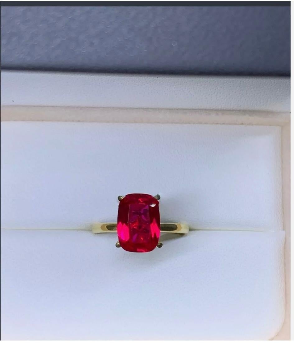4.02ct Ruby Lab Grown Solitaire Engagement Ring 18ct Yellow Gold
Make a statement with this stunning 4.02ct lab-grown ruby solitaire engagement ring in 18ct yellow gold. The incredibly vibrant and rich ruby is cut to a very good grade with an
