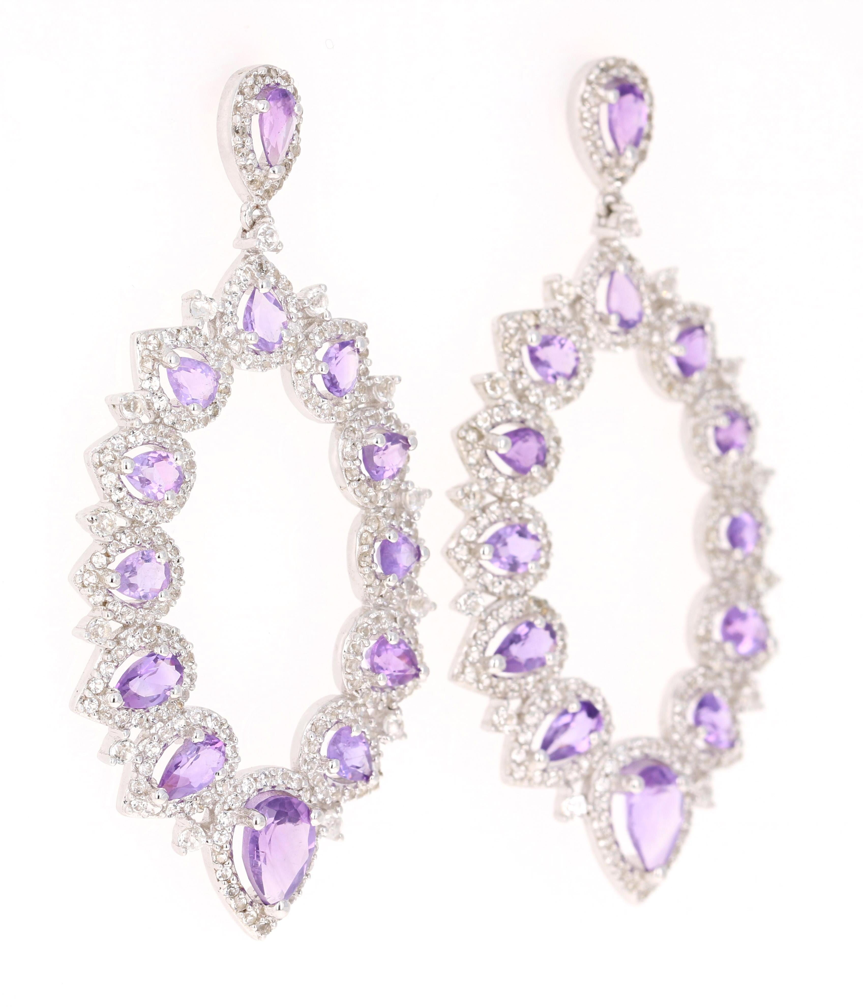 Stunning Chandelier Dangle Earrings 

These earrings have 4.03 Carats of Amethyst and White Topaz.

They are beautifully curated in 925 Silver weighing approximately 12.7 grams 

They are 2 inches long. 
