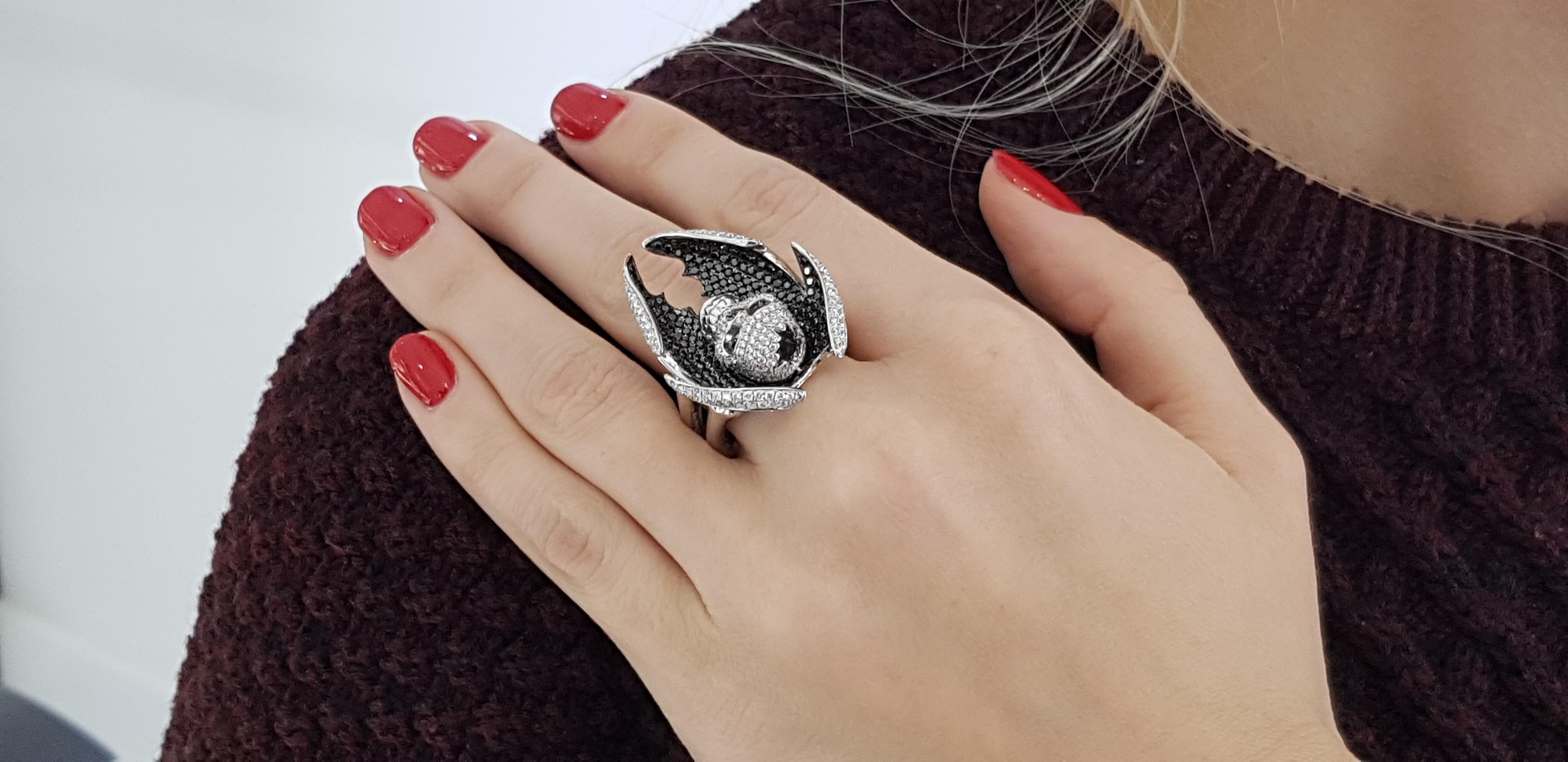 Made by Tresor Paris this Contemporary and extraordinary ring has a total of 4.03 Carats featuring 2.25 carat of Black Diamonds with magnificent 1.78 carat White Round Cut Diamonds White color G/H clarity VS. A totally unique addition to your