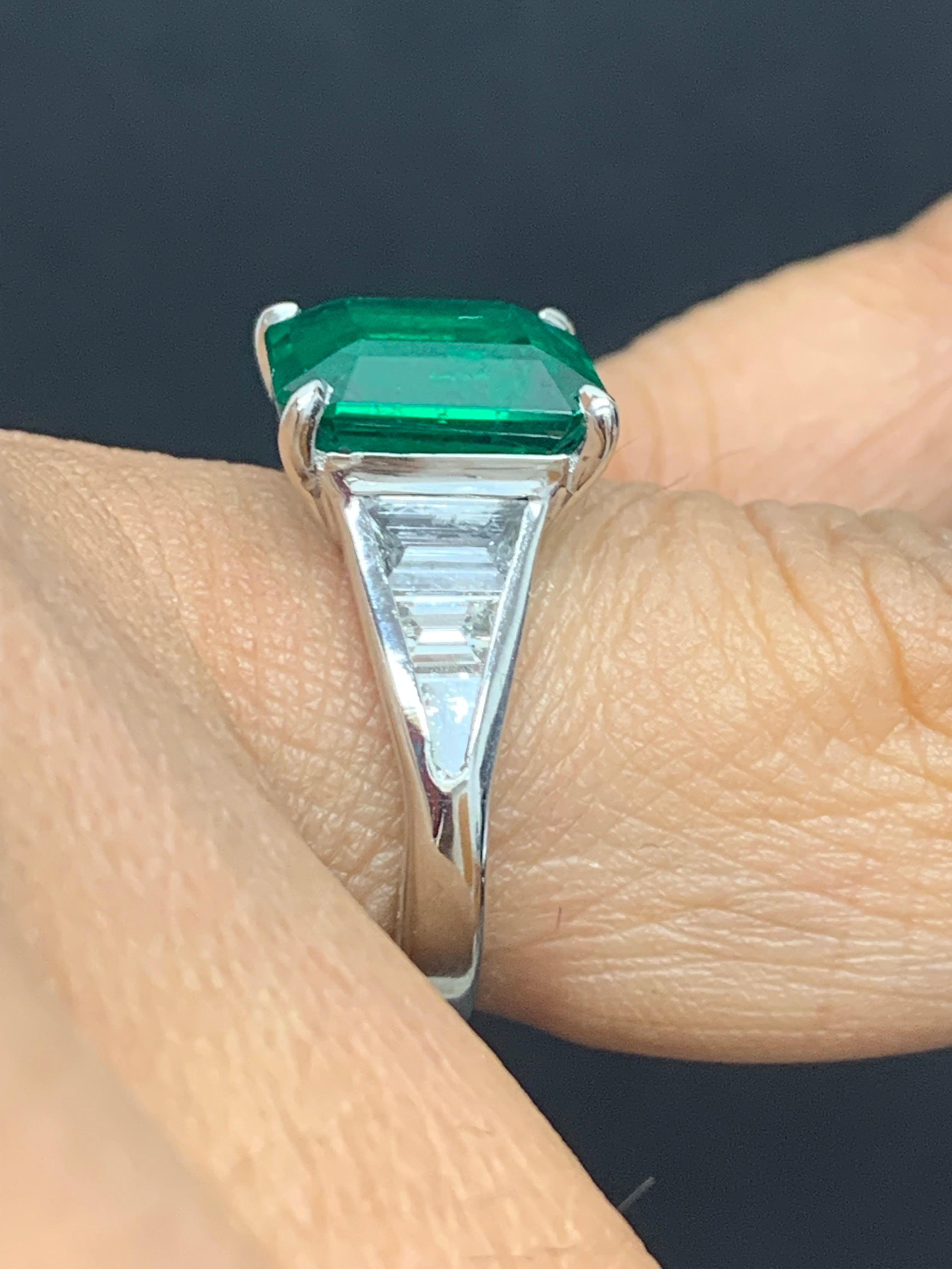 Modern 4.03 Carat Emerald Cut Emerald and Diamond Engagement Ring in Platinum For Sale
