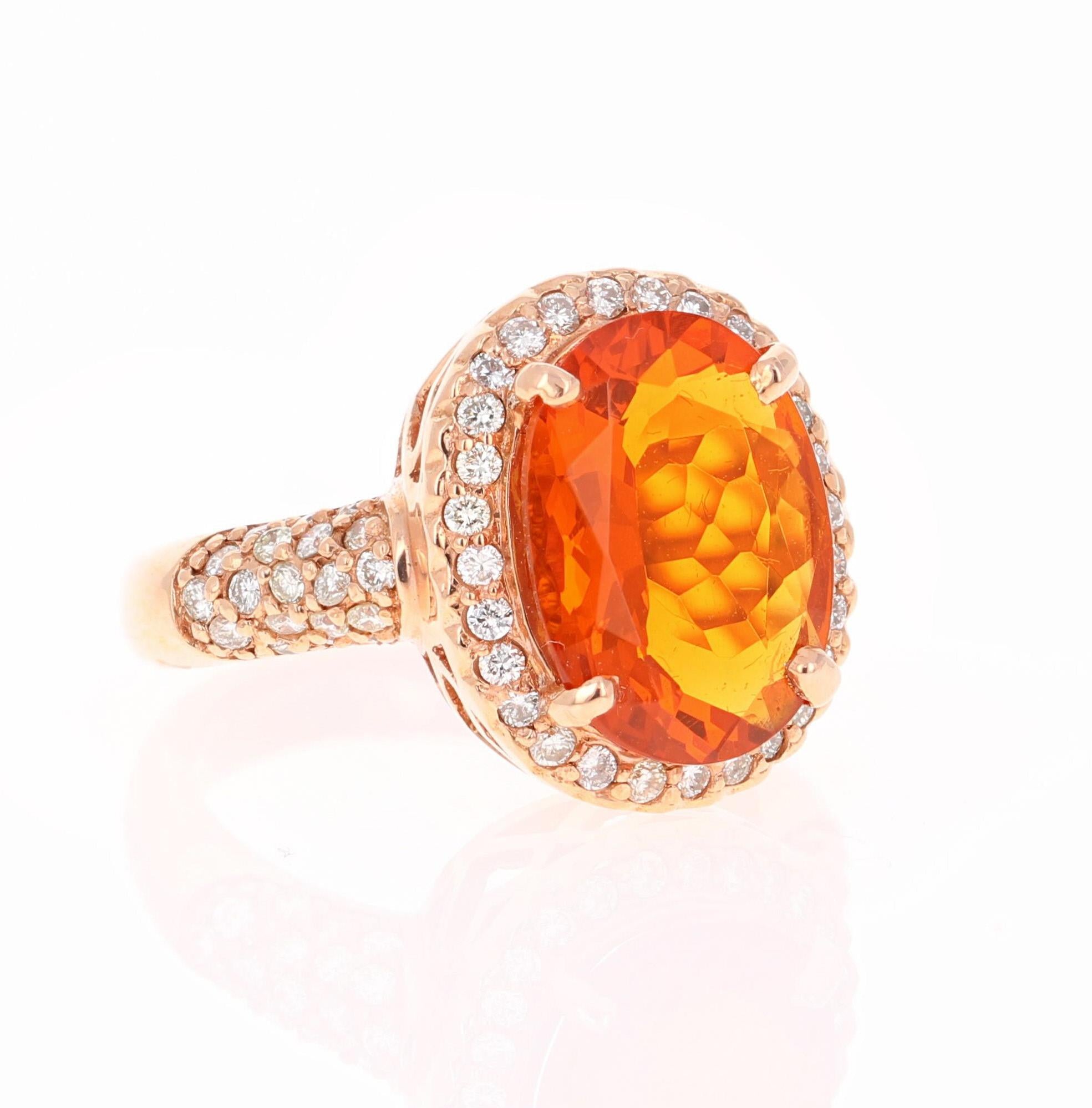 This ring has a 3.30 carat Oval Cut Fire Opal in the center of the ring and is surrounded by 66 Round Cut Diamonds that weigh a total of 0.73 carats.  The total carat weight of the ring is 4.03 carats. The Orange Mexican Fire Opals are considered