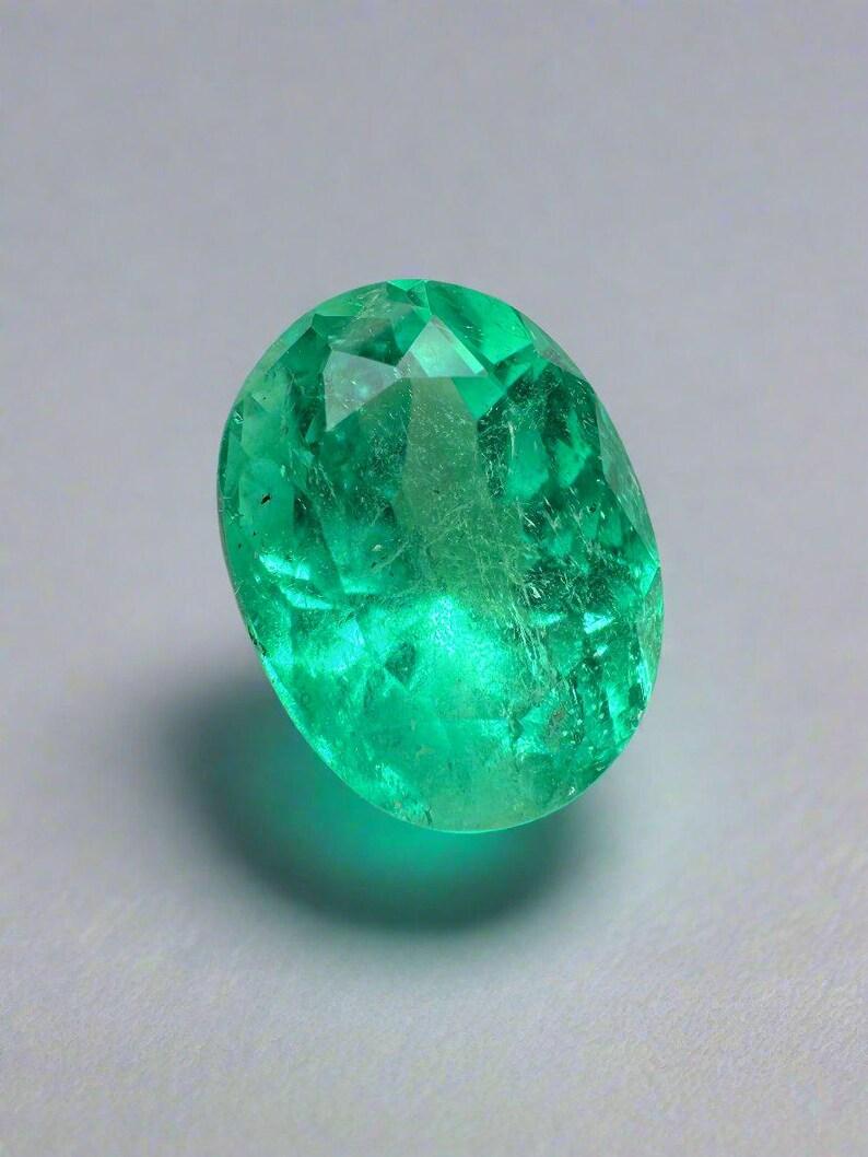 Stone: Emerald
Weight: 4.03-carats
Shape: Oval Cut
Clarity: Transparent
Luster: Very Good
Color: Pure Medium Green
Measurements: 10.99mm x 8.34mm x 7.61mm
Geographic Origin: Colombia
Treatment: Natural, Oiling

Comments: Due to their growth