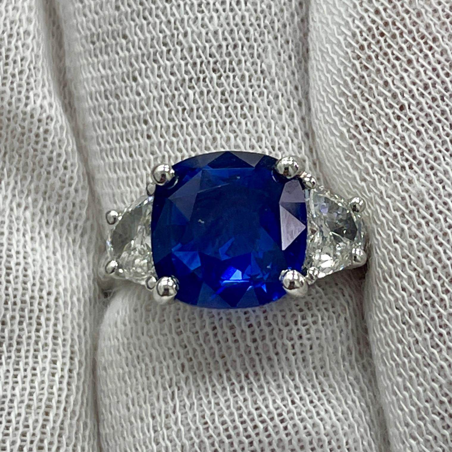 This is a LIVELY blue sapphire, mounted in an elegant 18K white gold and diamond ring with 0.61Ct of brilliant white diamonds. Suitable for any occasion!
