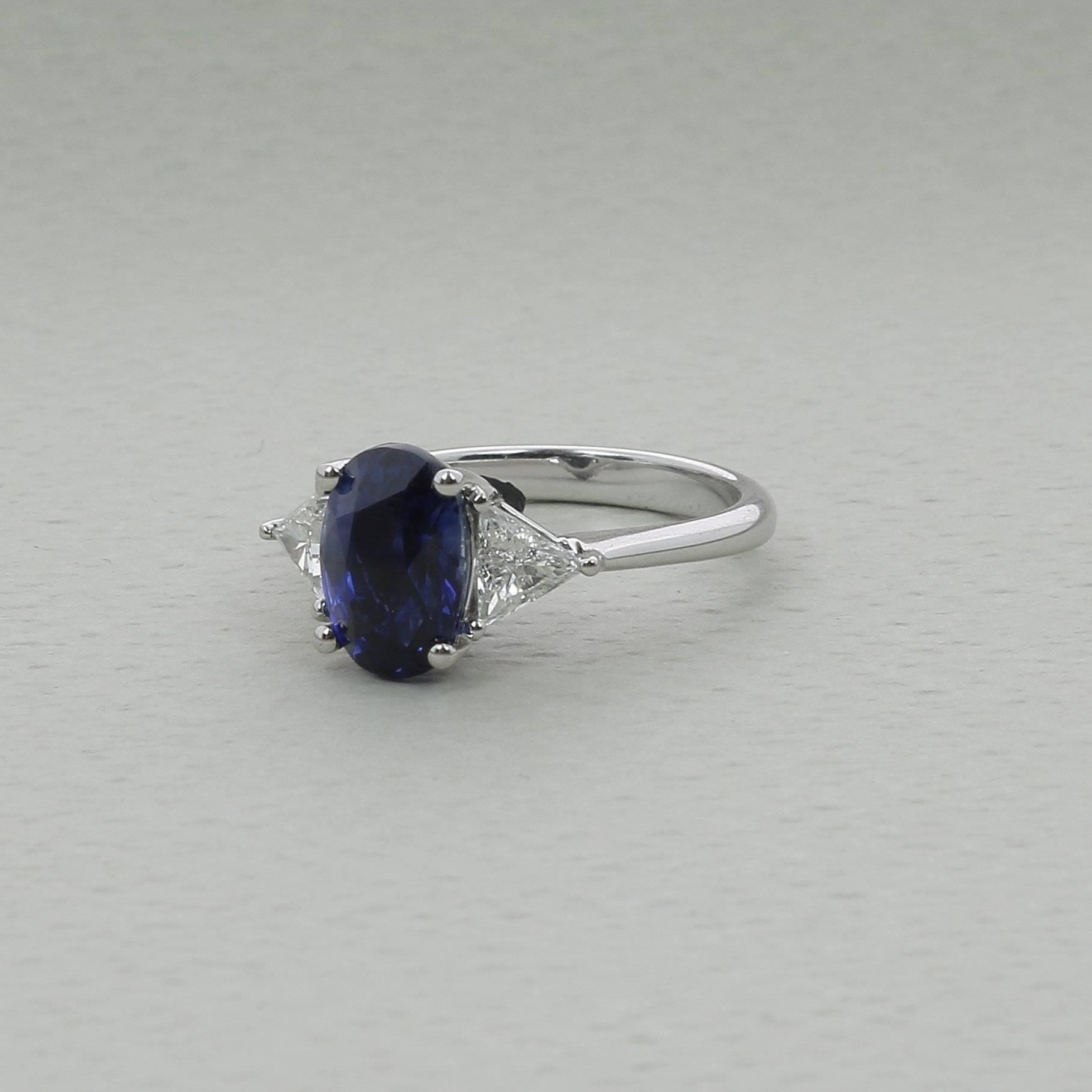 Contemporary 4.03 Carat Blue Sapphire Three-Stone Rings Trillion Diamonds 18K White Gold For Sale