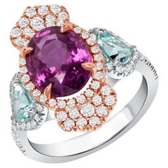 4.03ct Boysenberry Sapphire and Mozambique Paraiba ring. GIA certified.