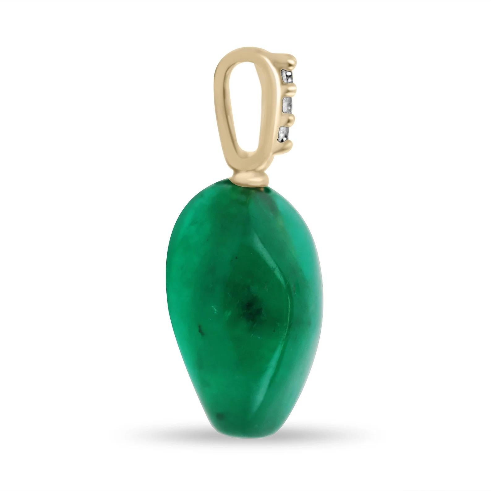 A stunning natural emerald baroque pendant. A fine thin 18K yellow gold pin, penetrates into a natural Colombian emerald baroque of fine quality. Displaying a vivid and deep medium-dark green color with excellent luster and clarity. At the top of